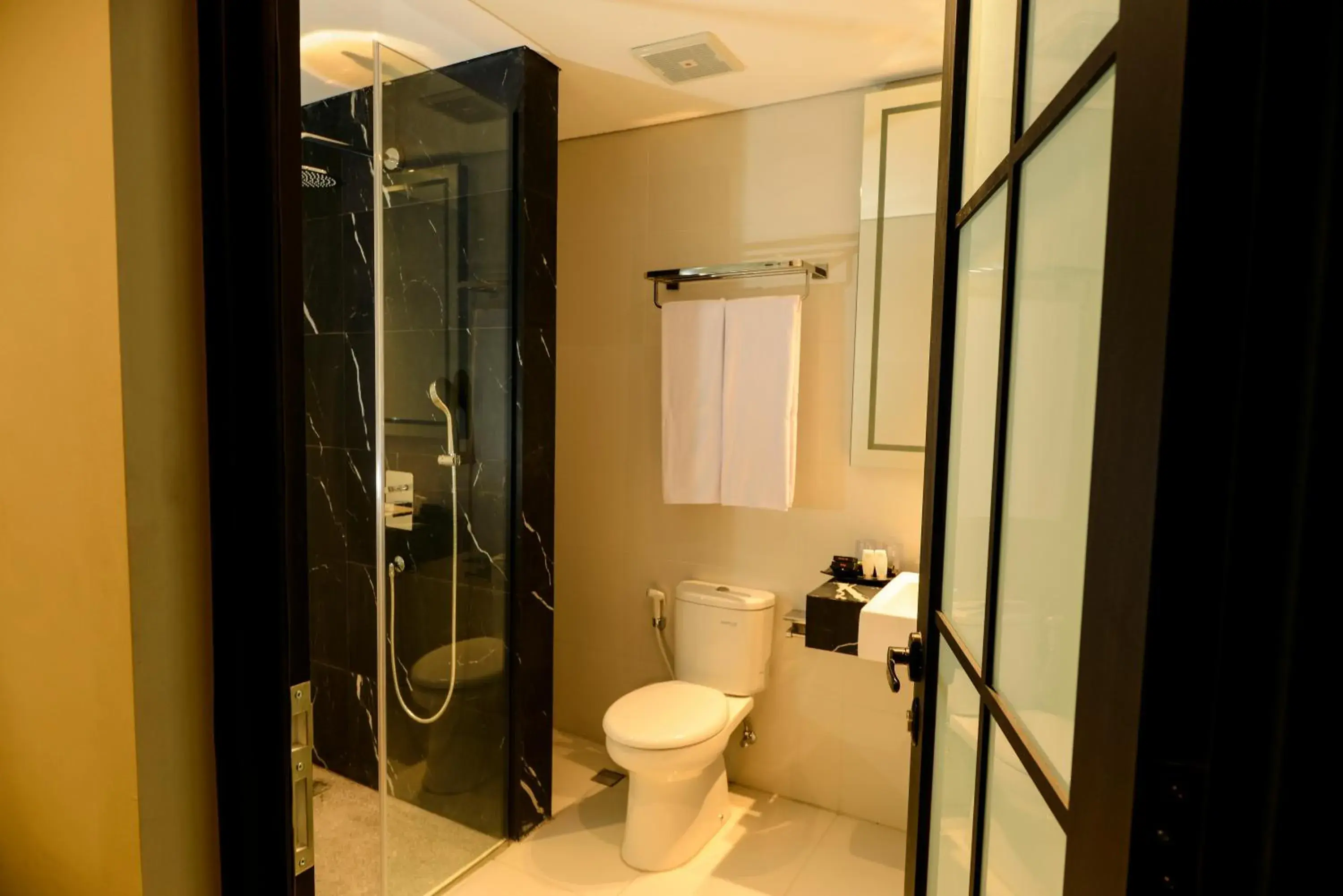 Bathroom in Nata Azana Hotel Solo Bathroom in Nata Azana Hotel Solo