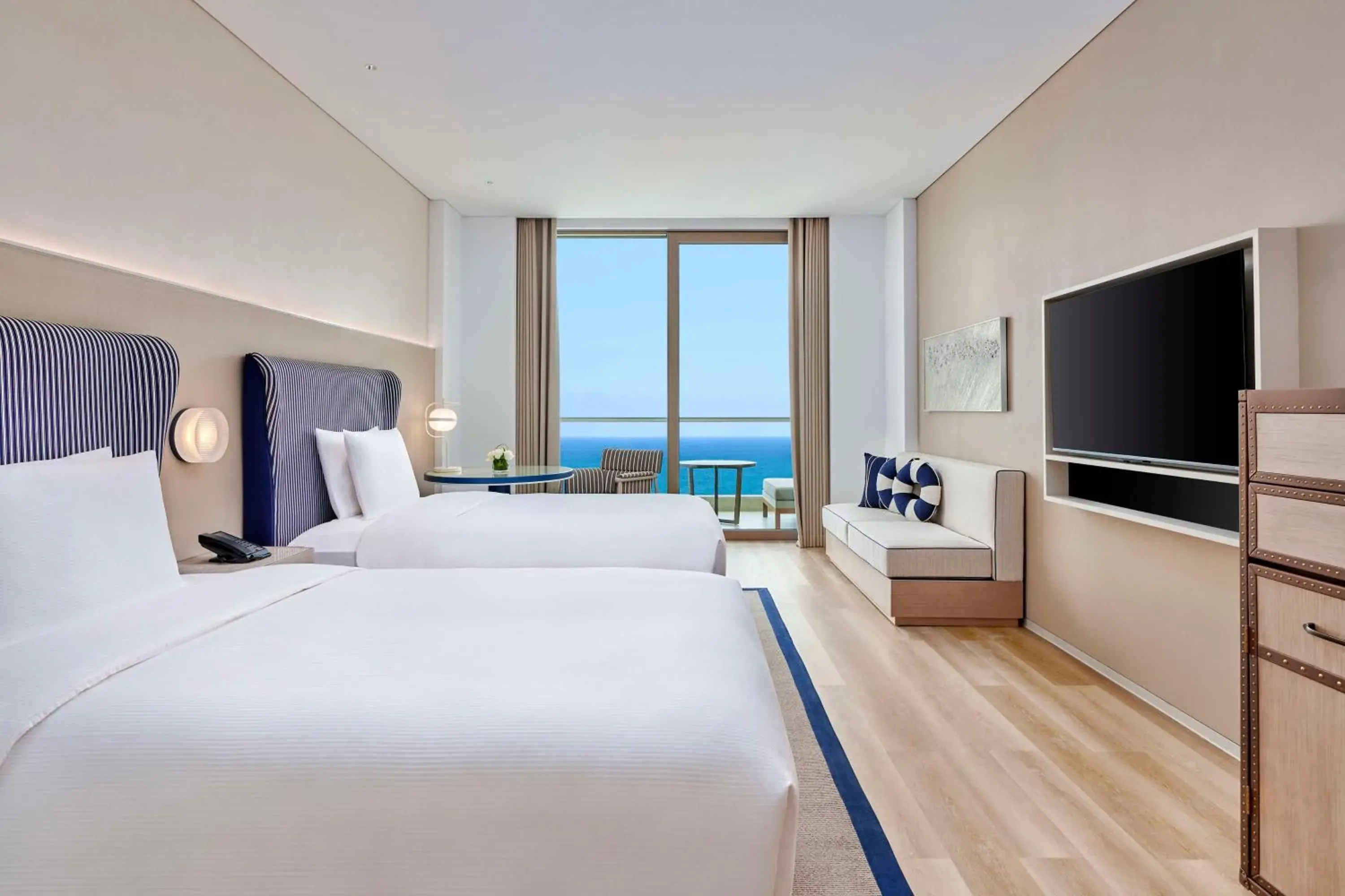 Living room, Bed in The Mermoon Resort Hainan Tufu Bay, Tapestry By Hilton Living room, Bed in The Mermoon Resort Hainan Tufu Bay, Tapestry By Hilton