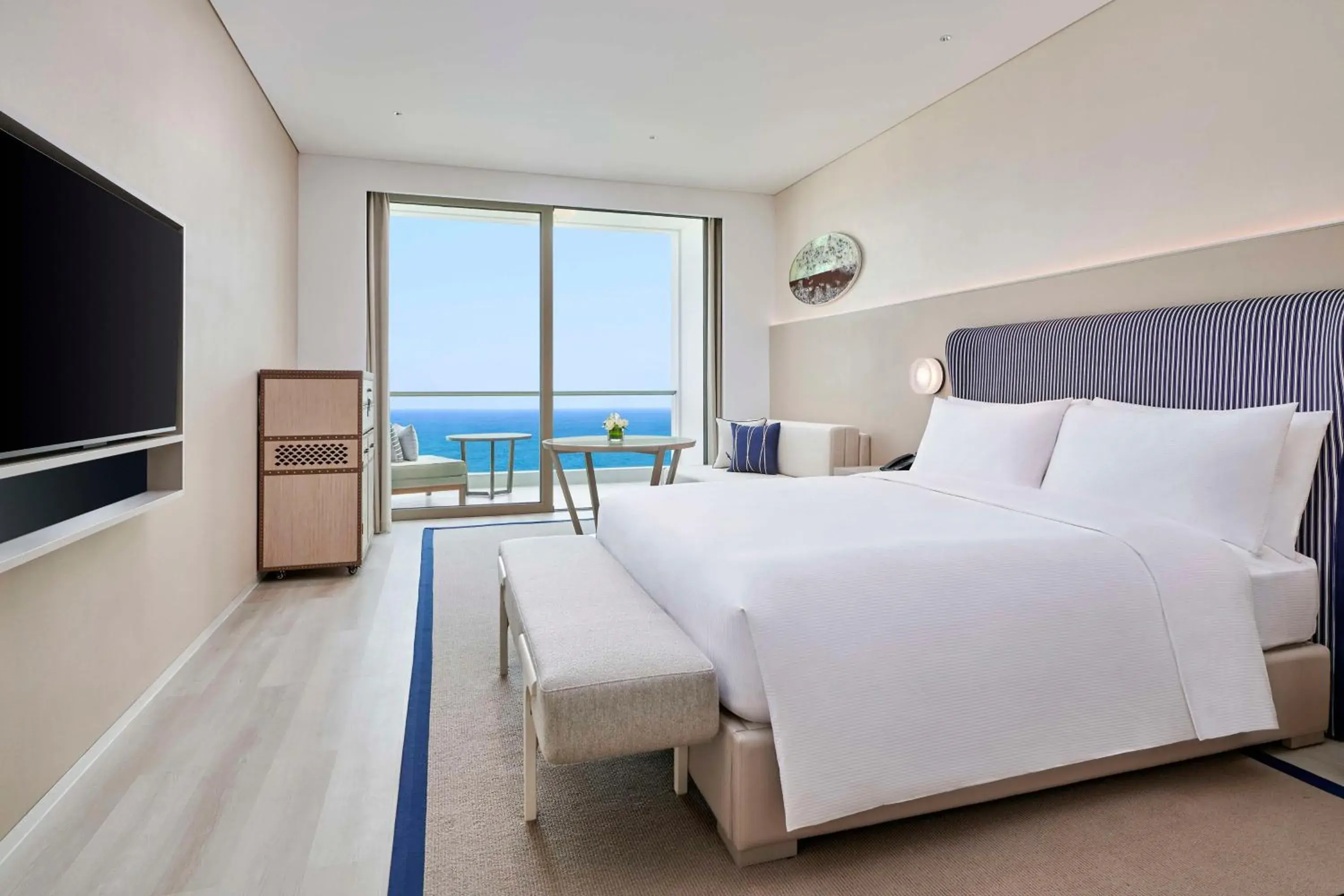 Living room, Bed in The Mermoon Resort Hainan Tufu Bay, Tapestry By Hilton Living room, Bed in The Mermoon Resort Hainan Tufu Bay, Tapestry By Hilton