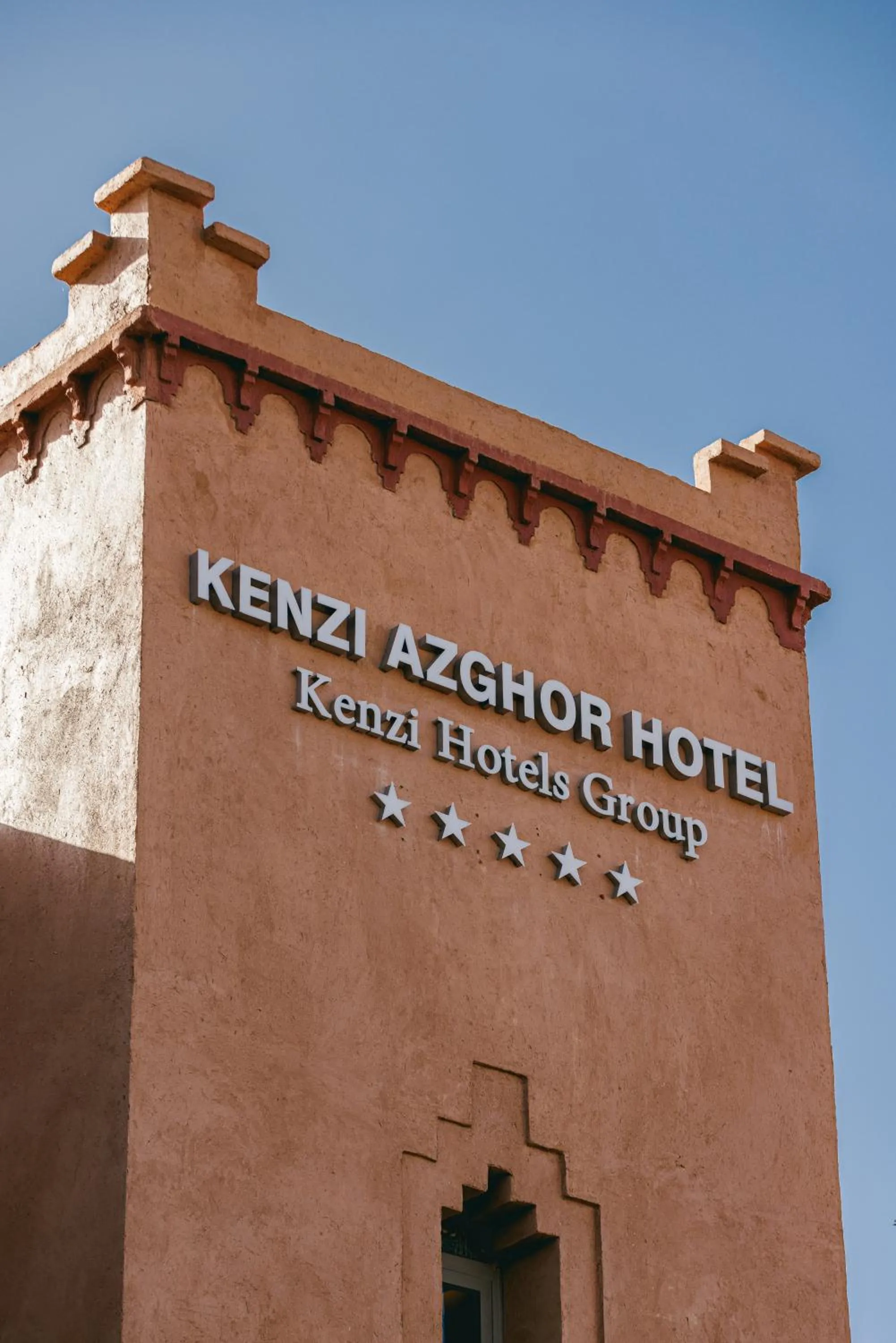 Property logo or sign in Kenzi Azghor