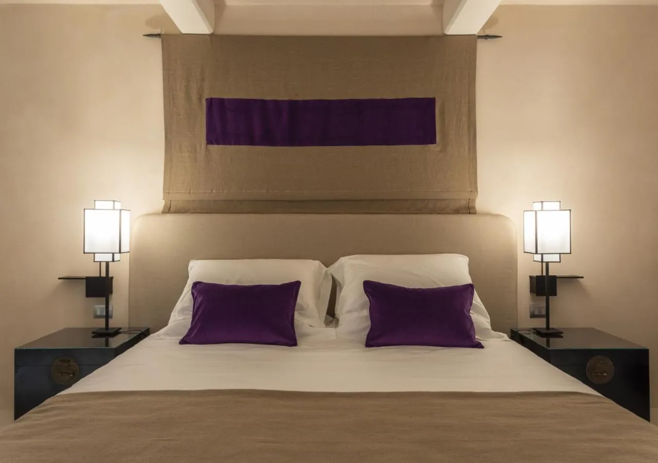 Bed in Hotel Palazzo Durazzo Suites