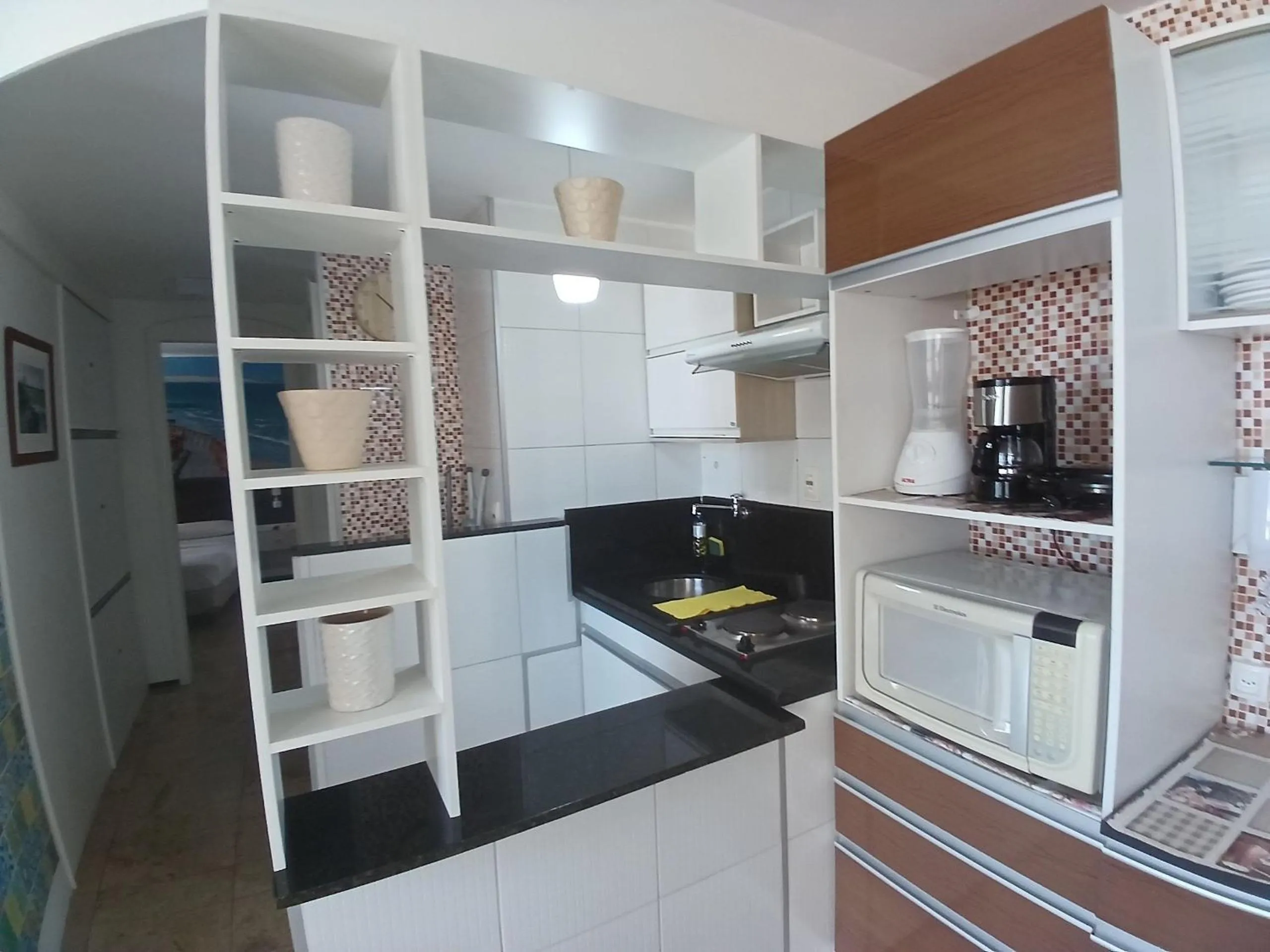 Kitchen or kitchenette in Flat Brasil Tropical Meireles by Escala