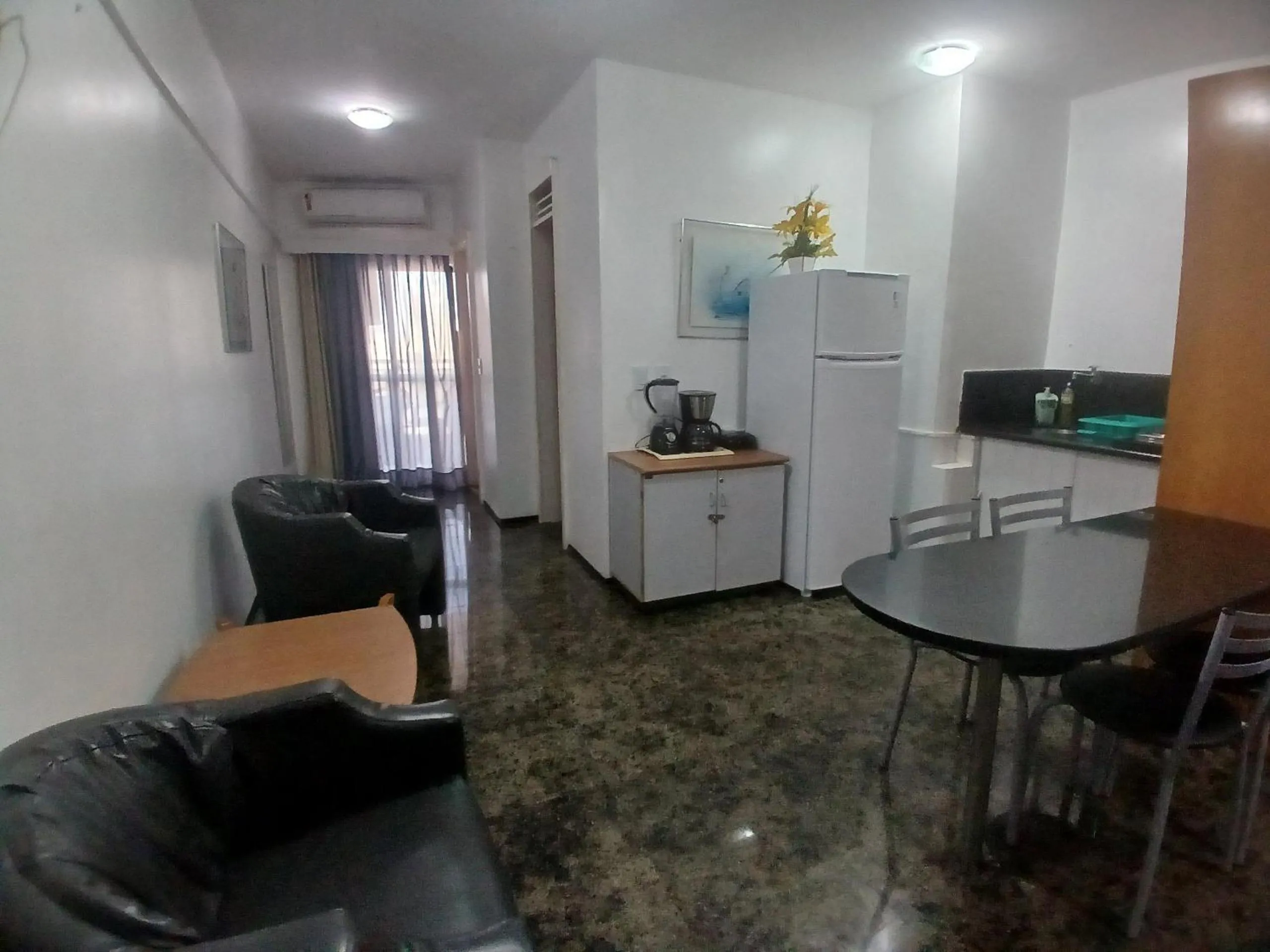 Living room in Flat Brasil Tropical Meireles by Escala