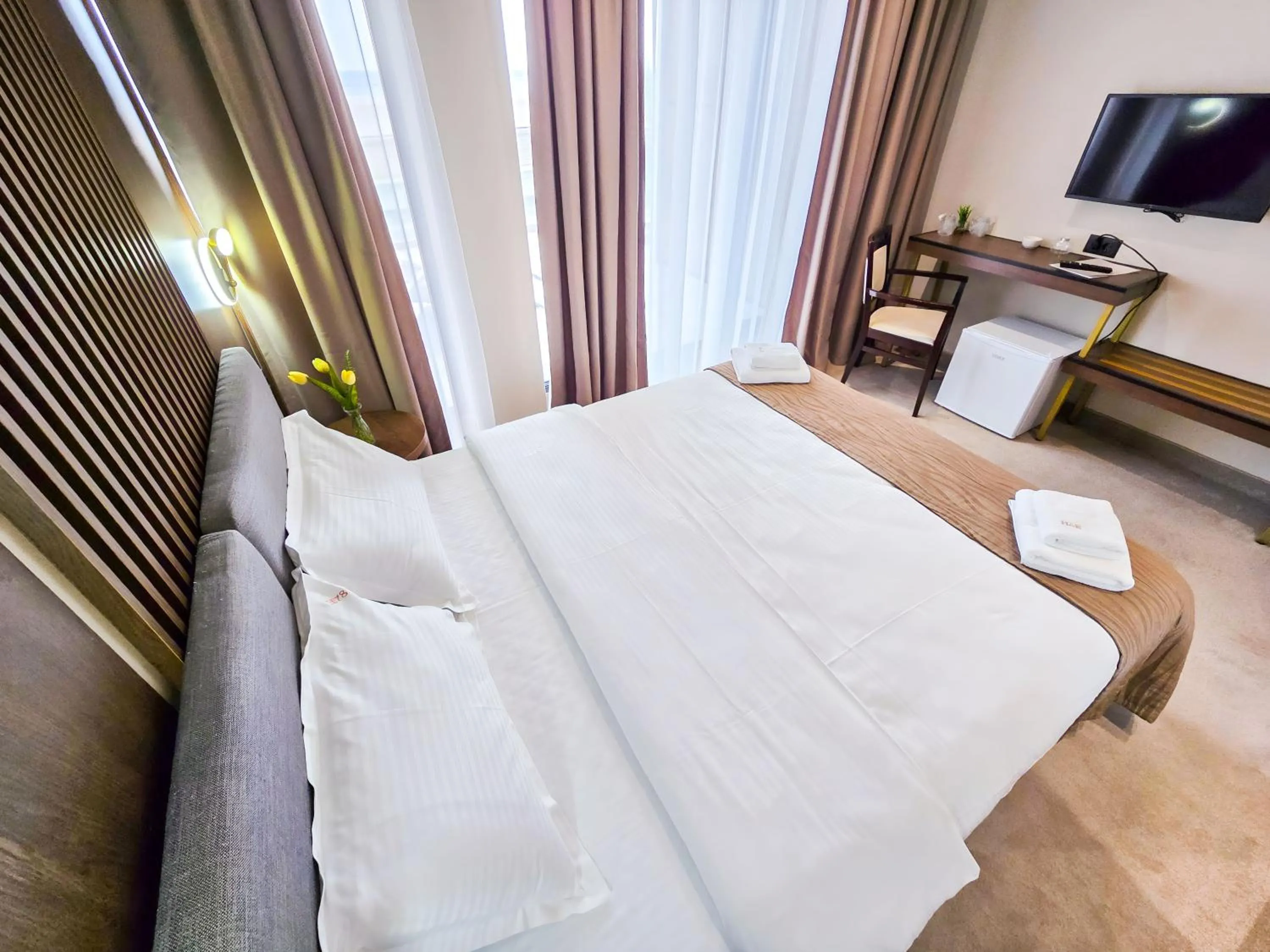 Bed in Sonio Boutique Hotel