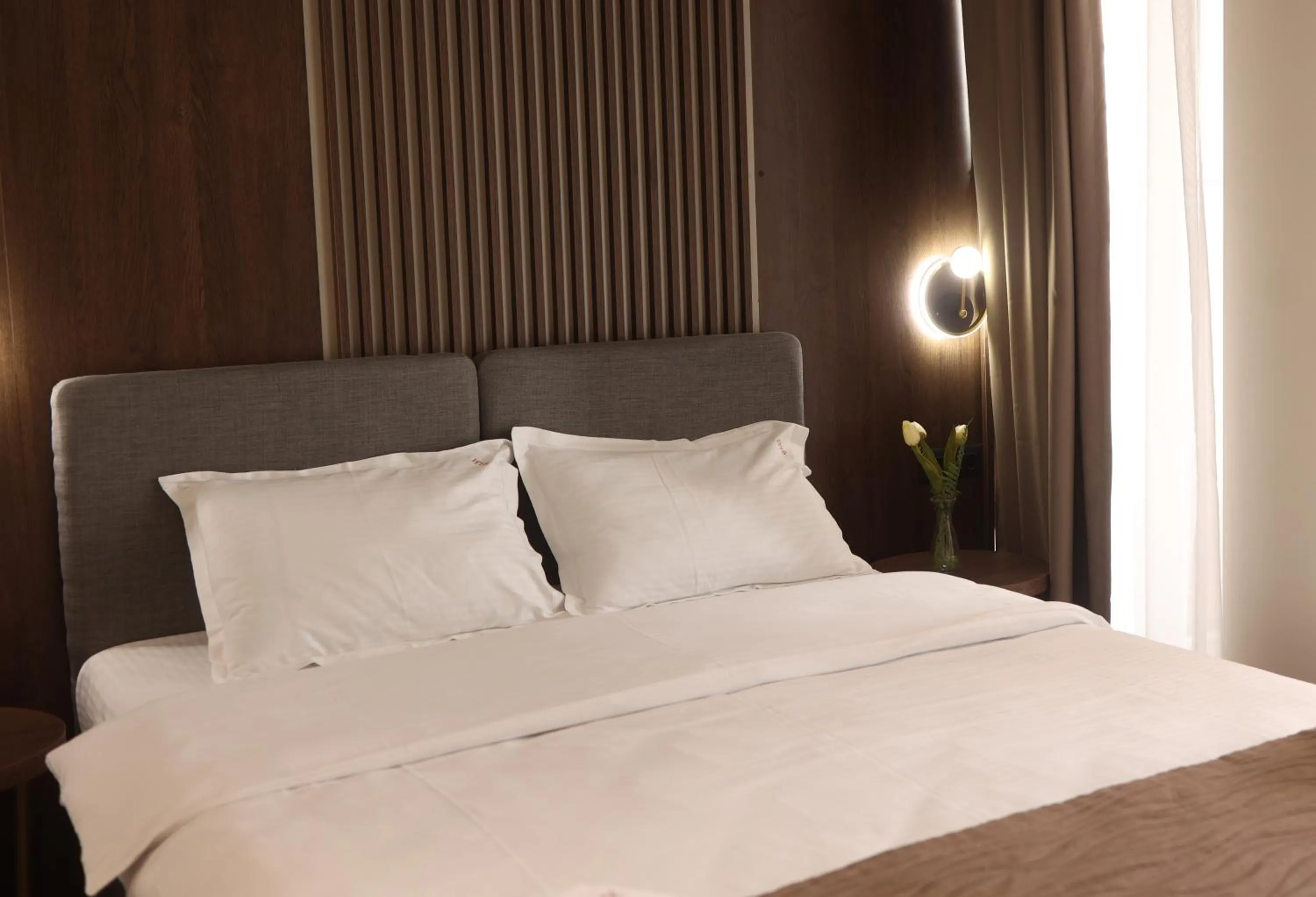 Bed in Sonio Boutique Hotel