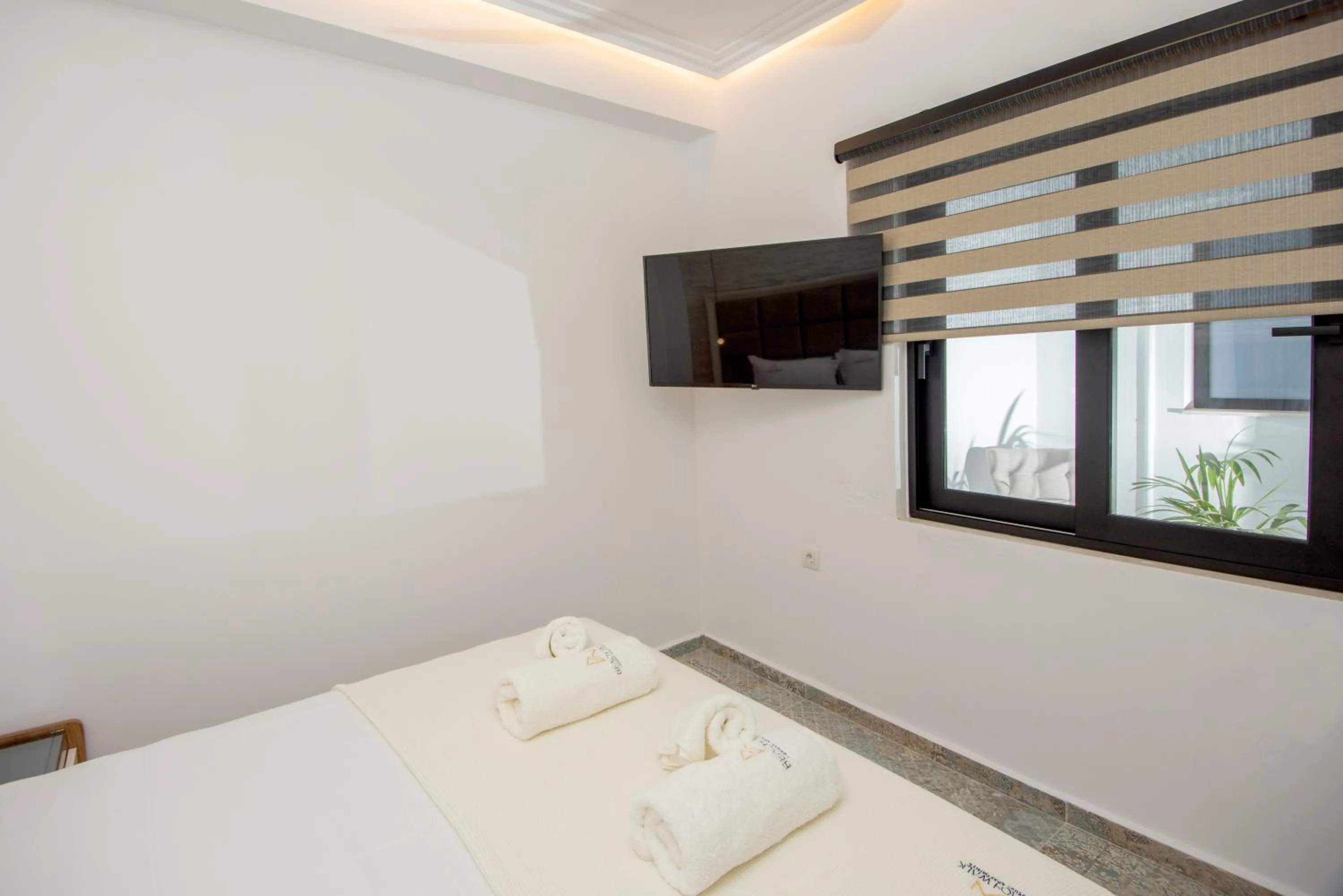 Bed in Beach Walk Luxury Suites