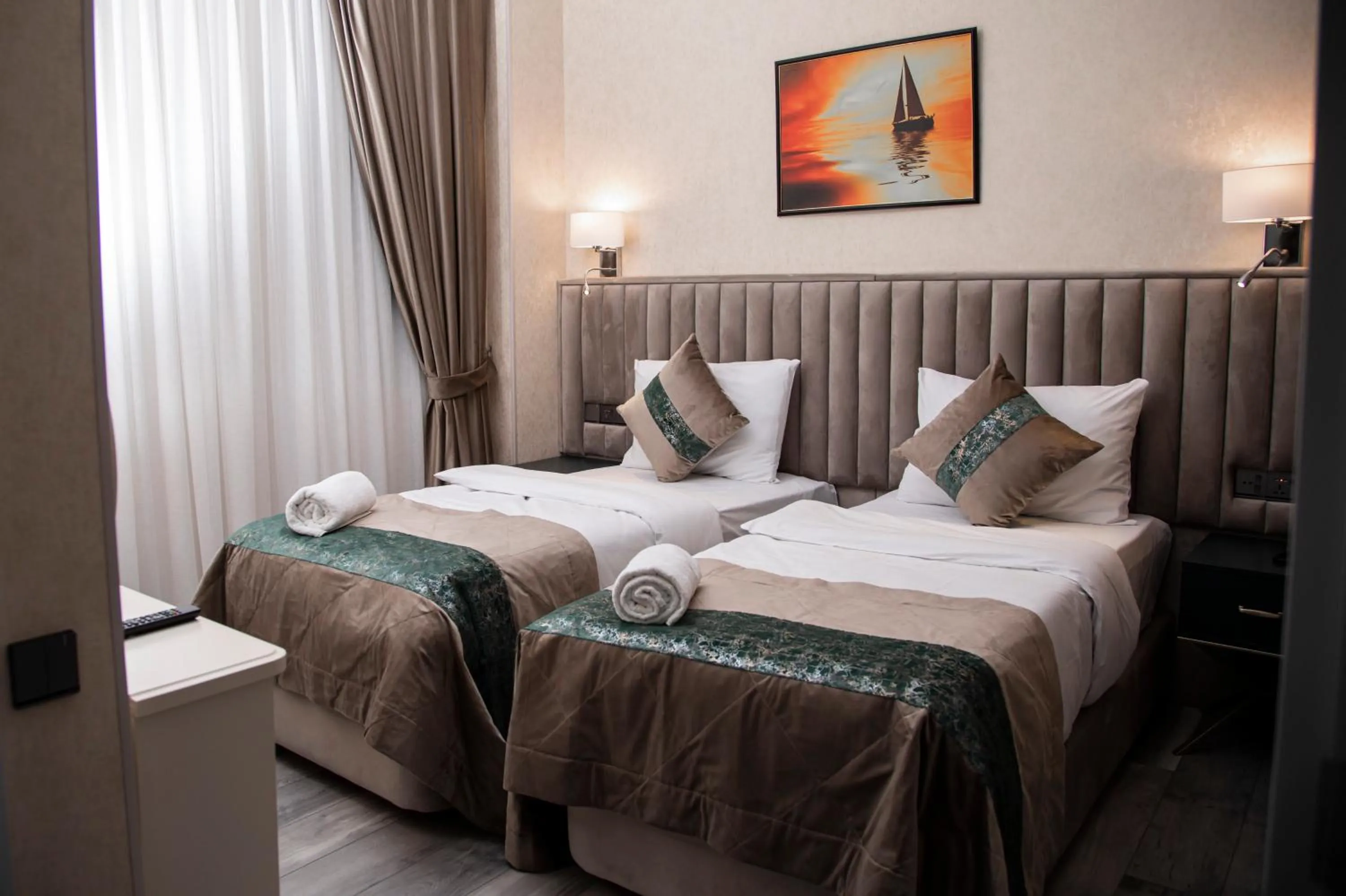 Bed in Essam Deluxe Hotel