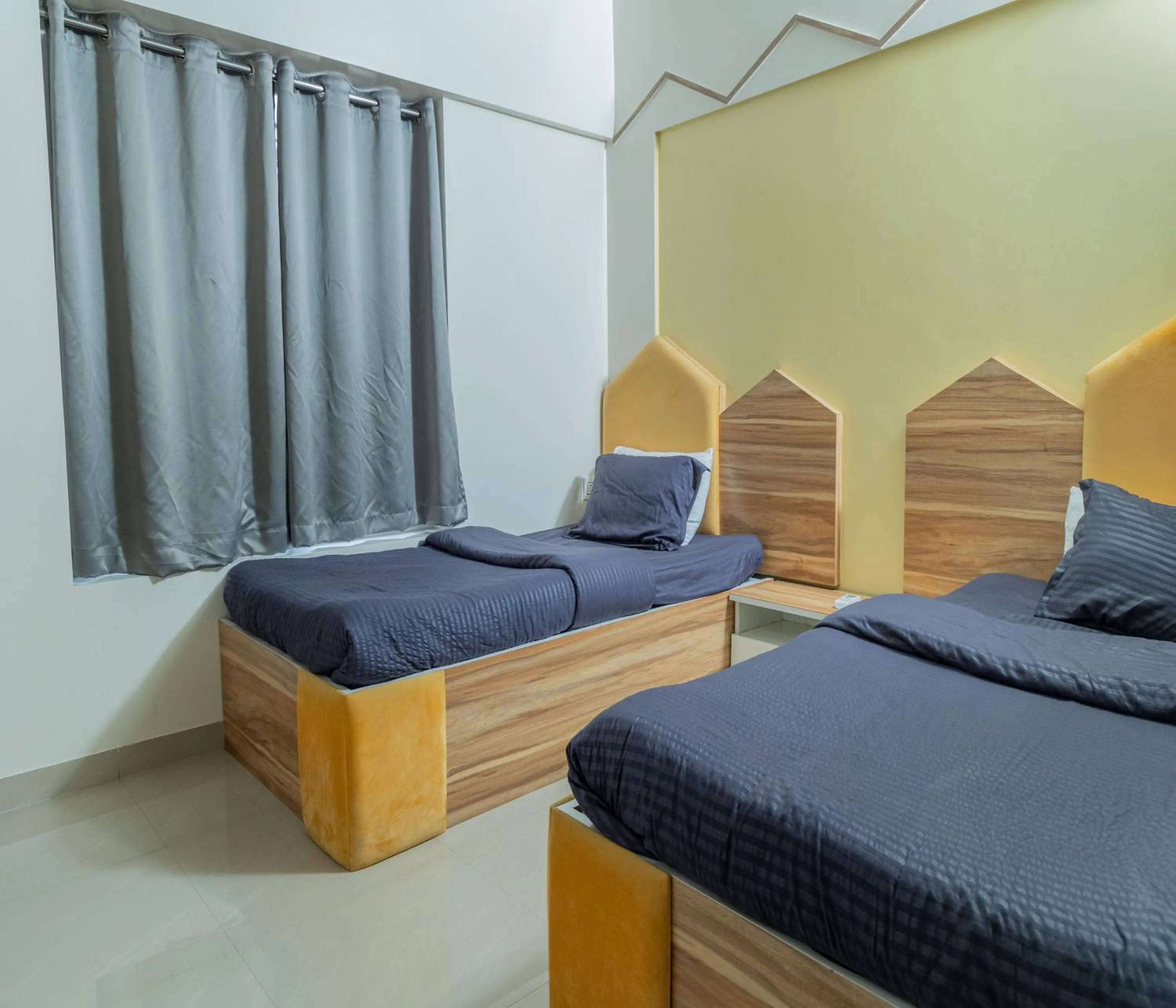 One Bedroom Apartment with Twin Bed and Mountain View in Copper 11 Service Apartments -SB Road, Shivaji Nagar, Pune