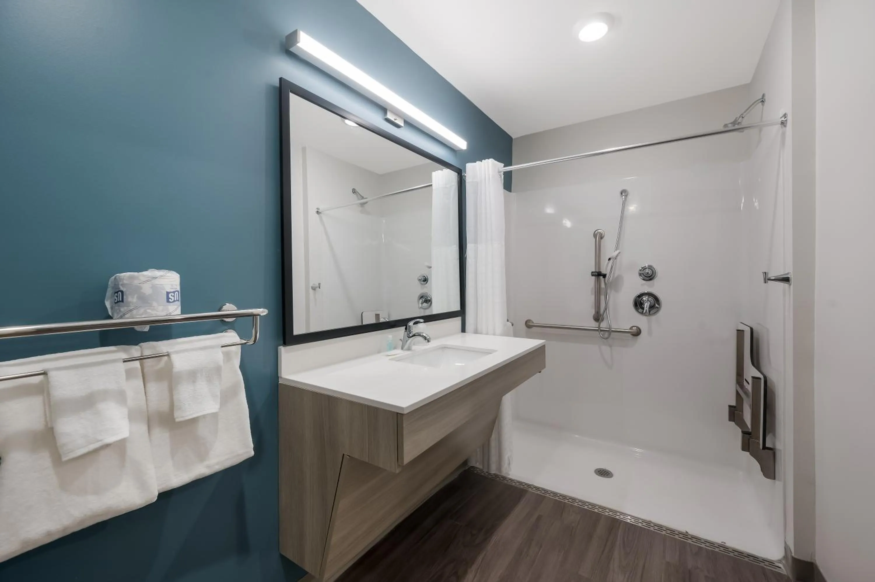 Bathroom in WoodSpring Suites Dearborn Detroit