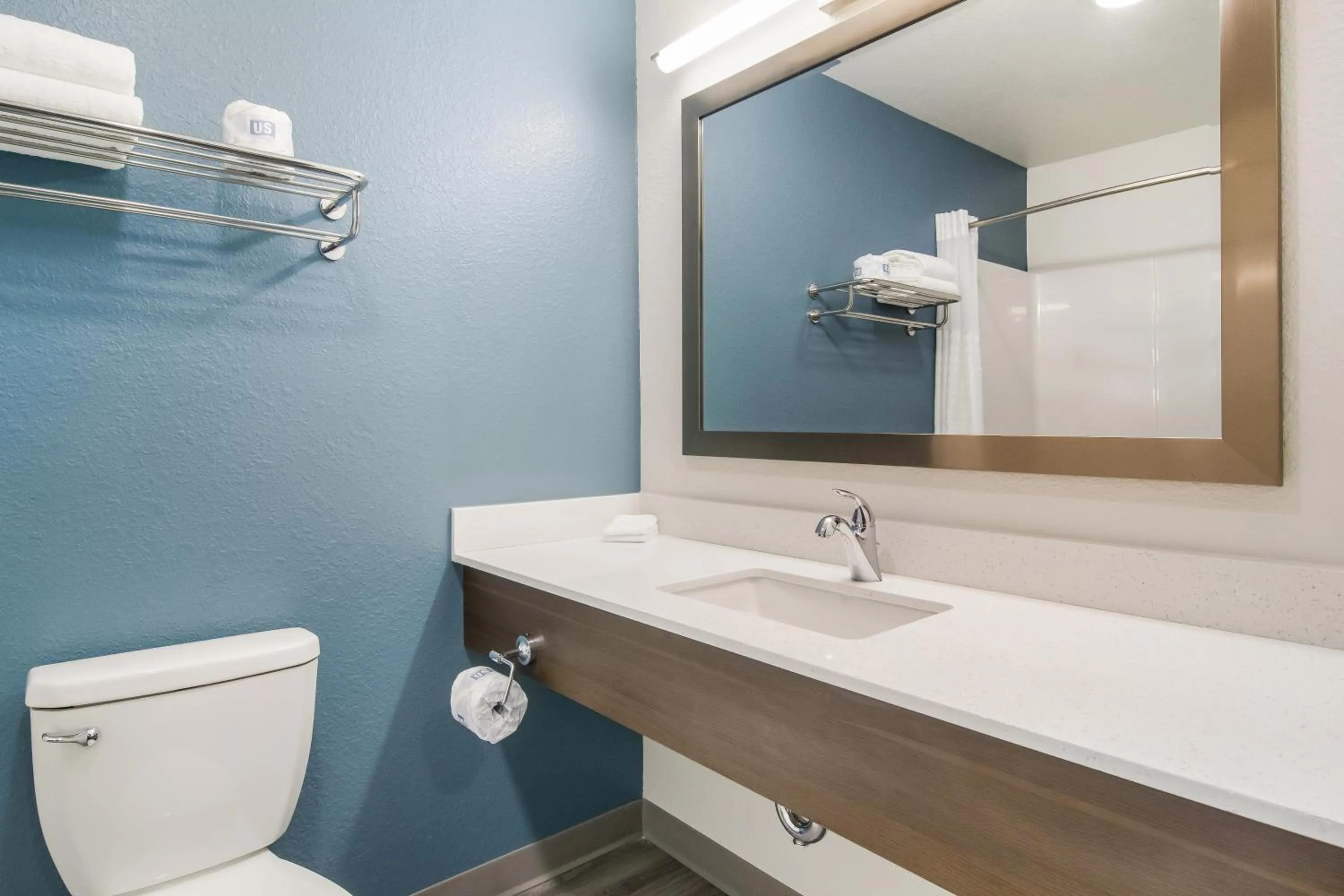 Bathroom in WoodSpring Suites Dearborn Detroit