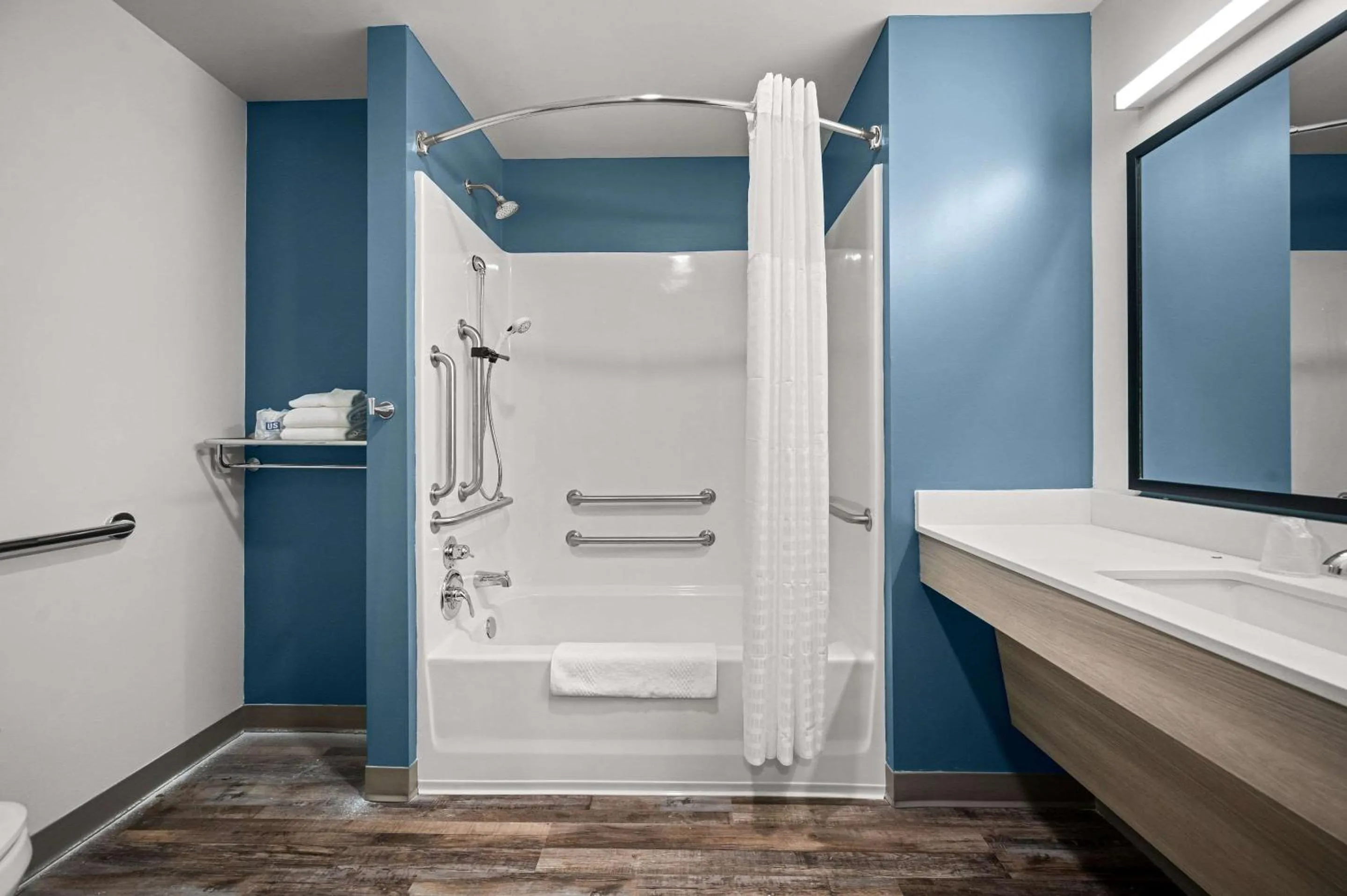 Bathroom in WoodSpring Suites Dearborn Detroit