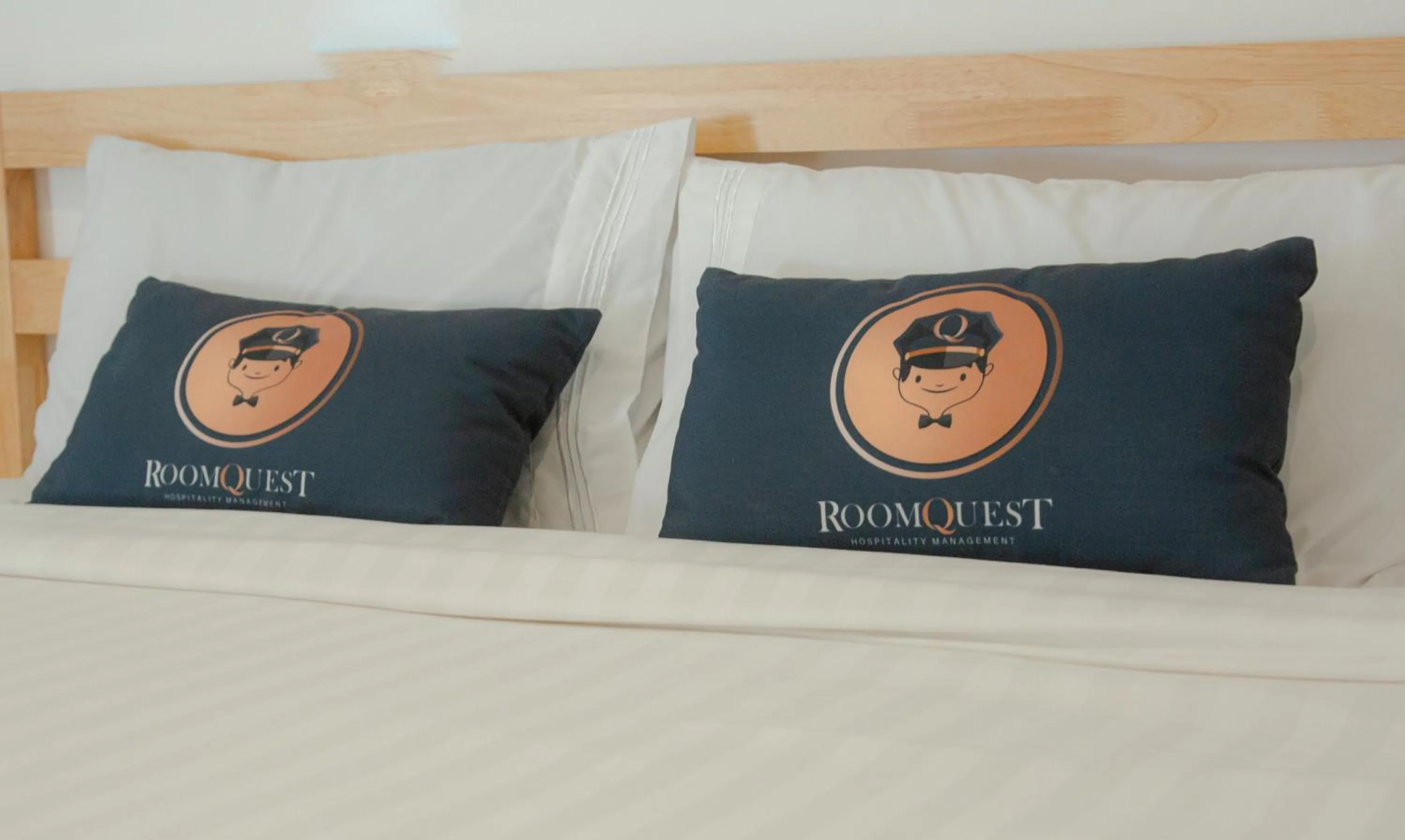 Bed in RoomQuest Phuket Patong Beach