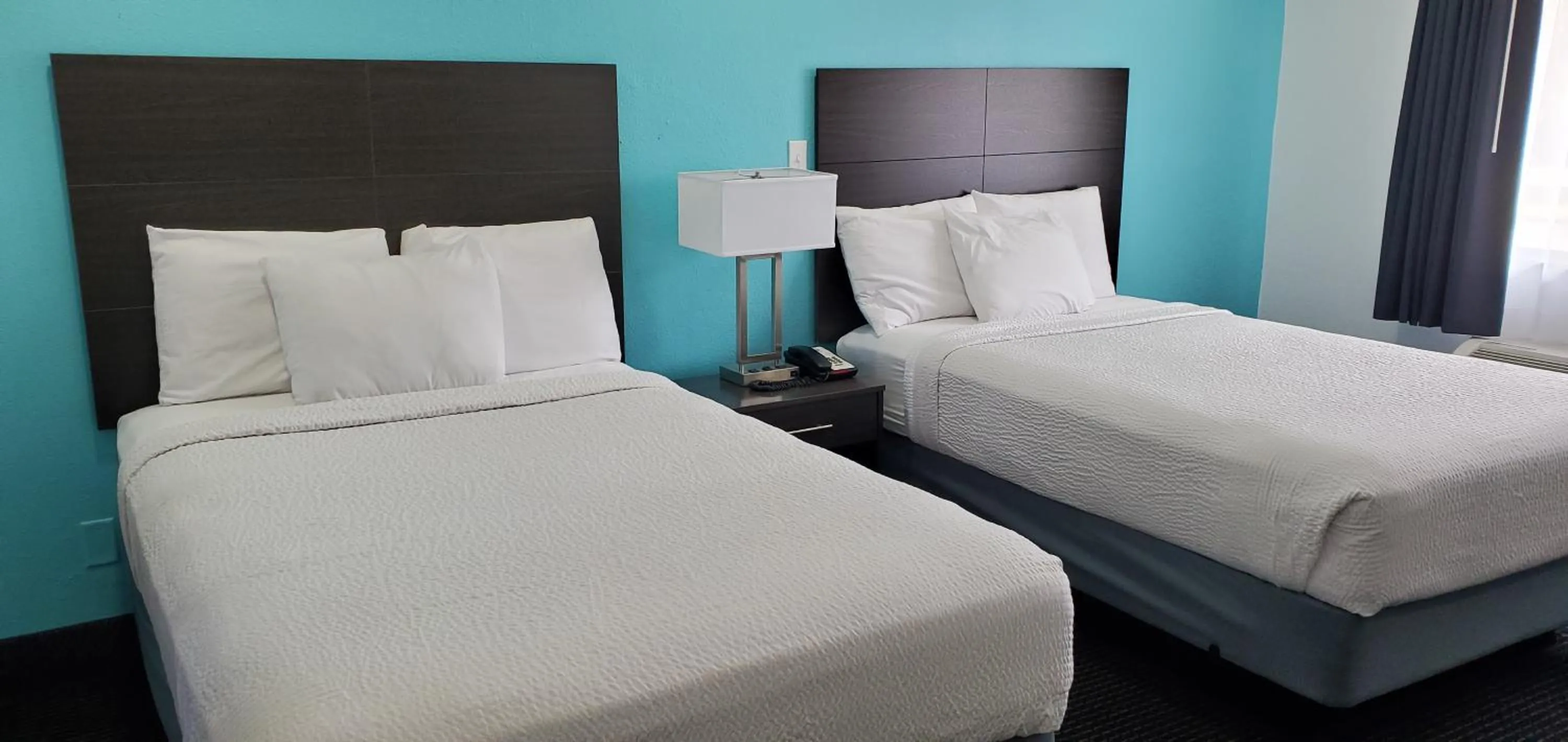 Photo of the whole room, Bed in Travelodge by Wyndham Livonia Canton Novi Detroit Area