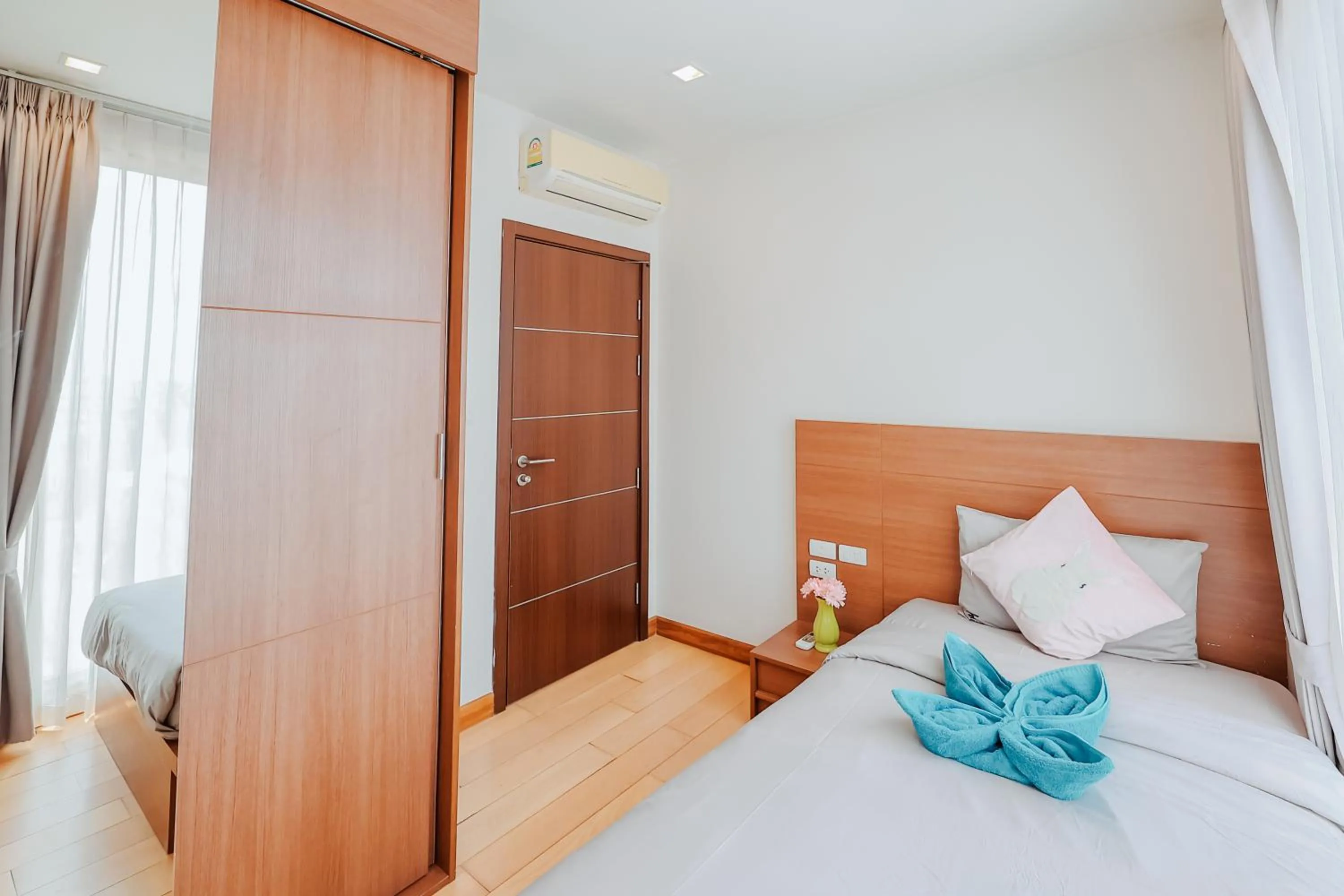 Bed in The Astra Condo Changkhlan in Chiang Mai