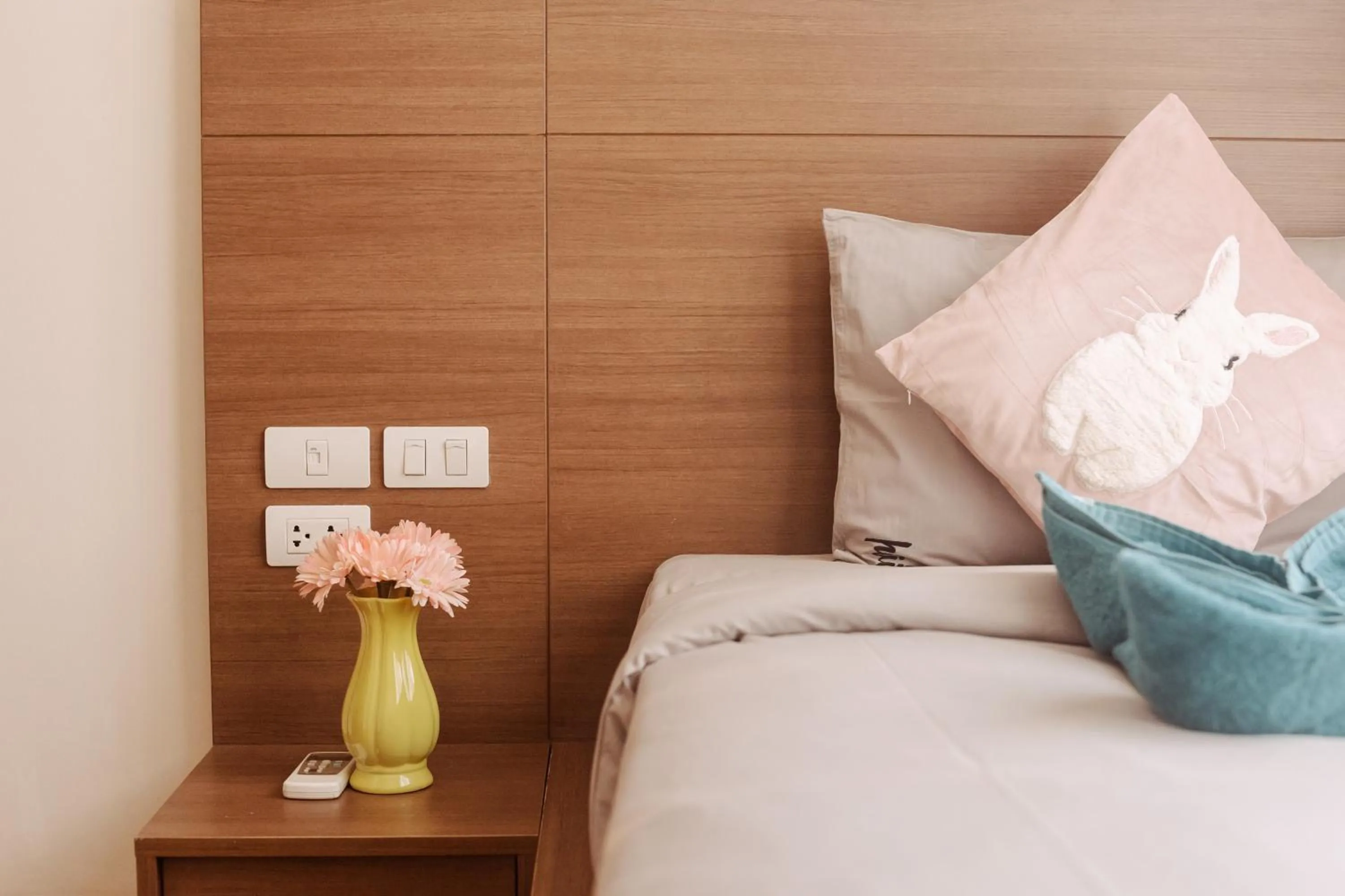 Bed in The Astra Condo Changkhlan in Chiang Mai