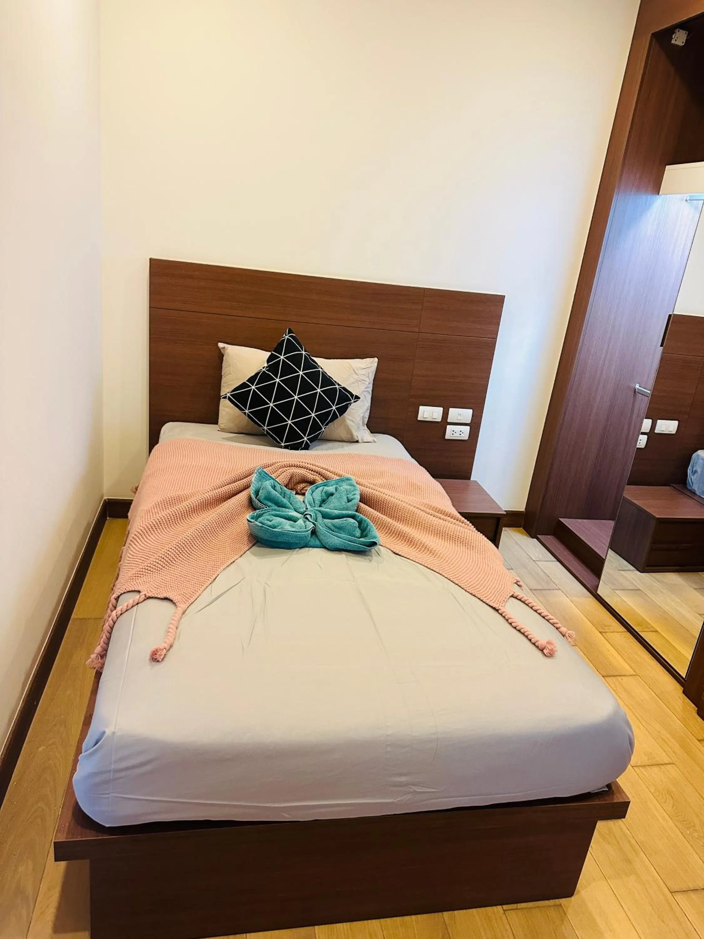 Bed in The Astra Condo Changkhlan in Chiang Mai