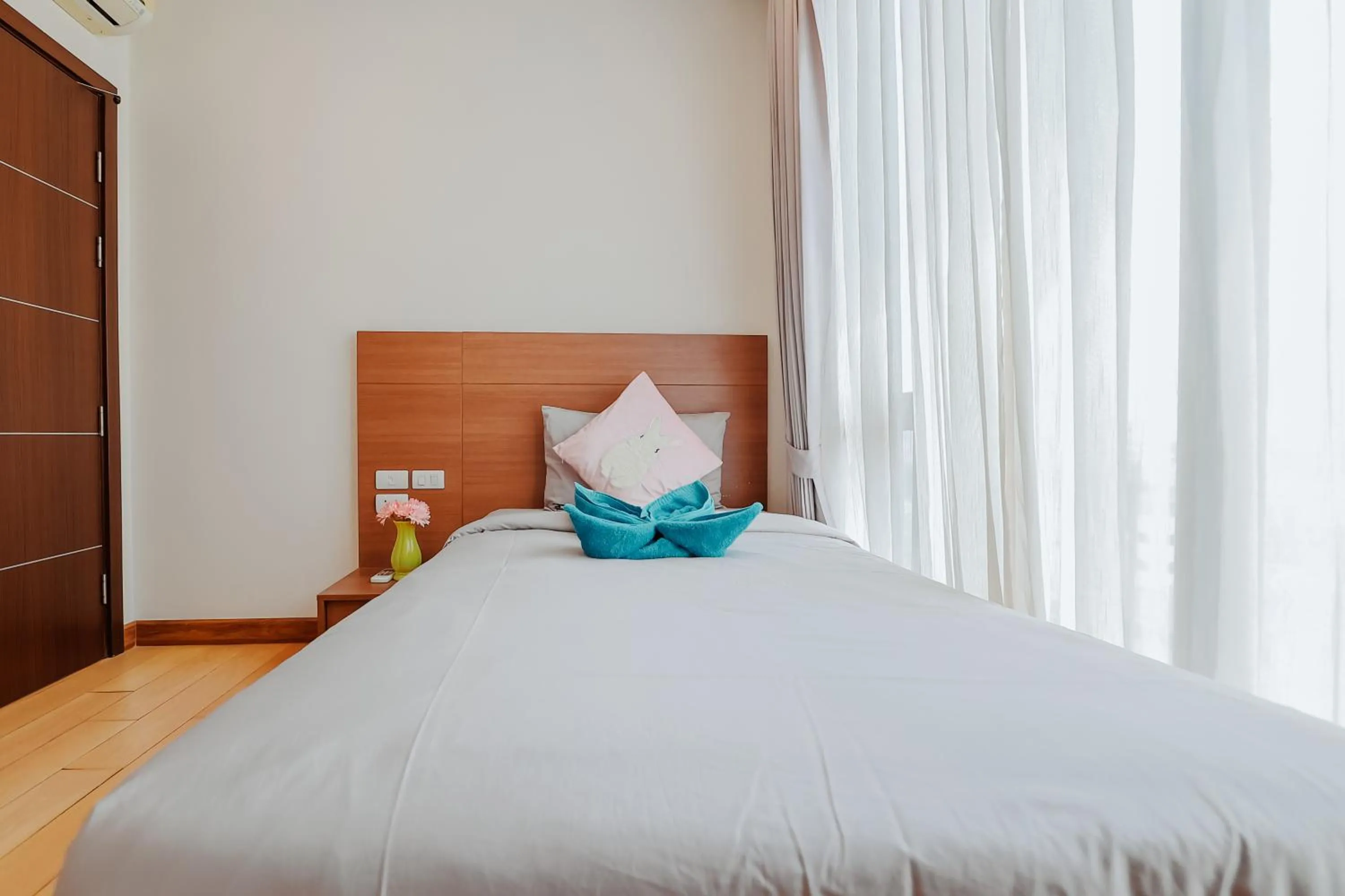 Bed in The Astra Condo Changkhlan in Chiang Mai