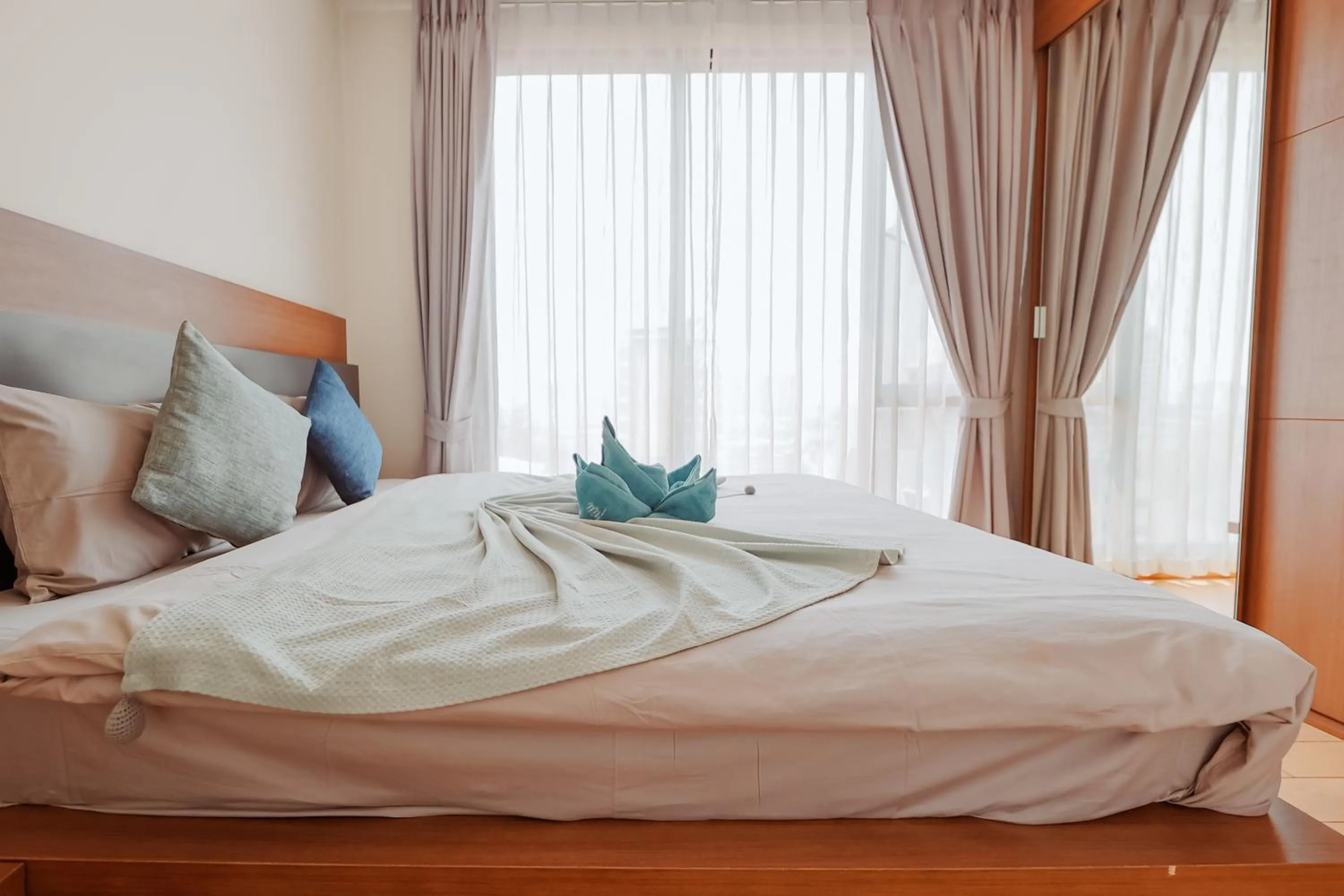 Bed in The Astra Condo Changkhlan in Chiang Mai