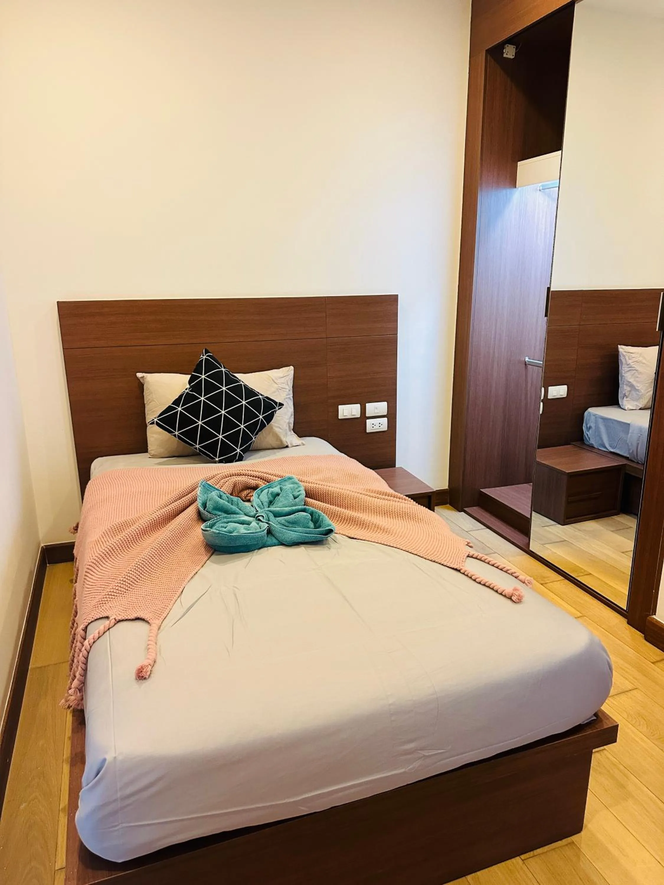 Bed in The Astra Condo Changkhlan in Chiang Mai