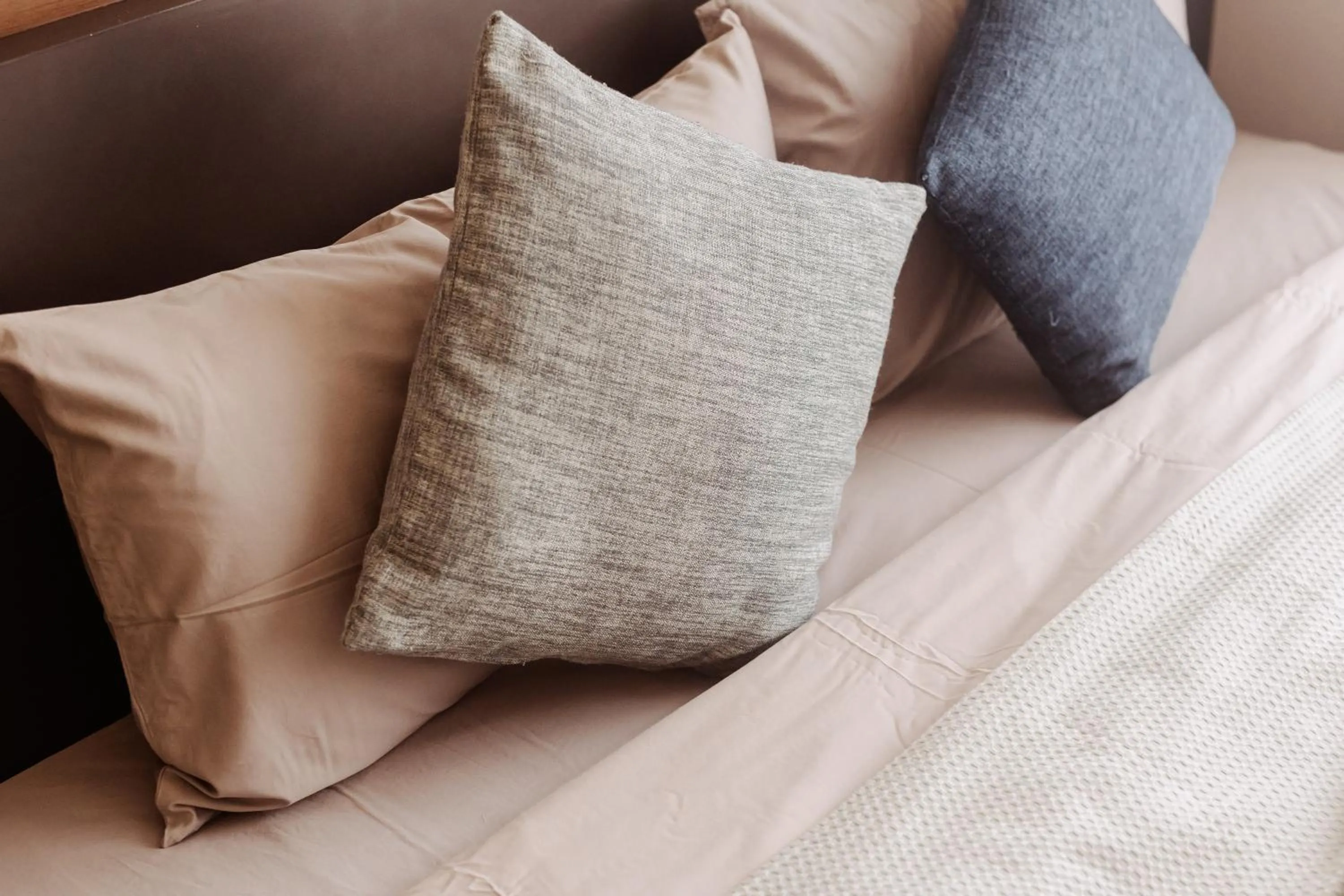 Bed in The Astra Condo Changkhlan in Chiang Mai