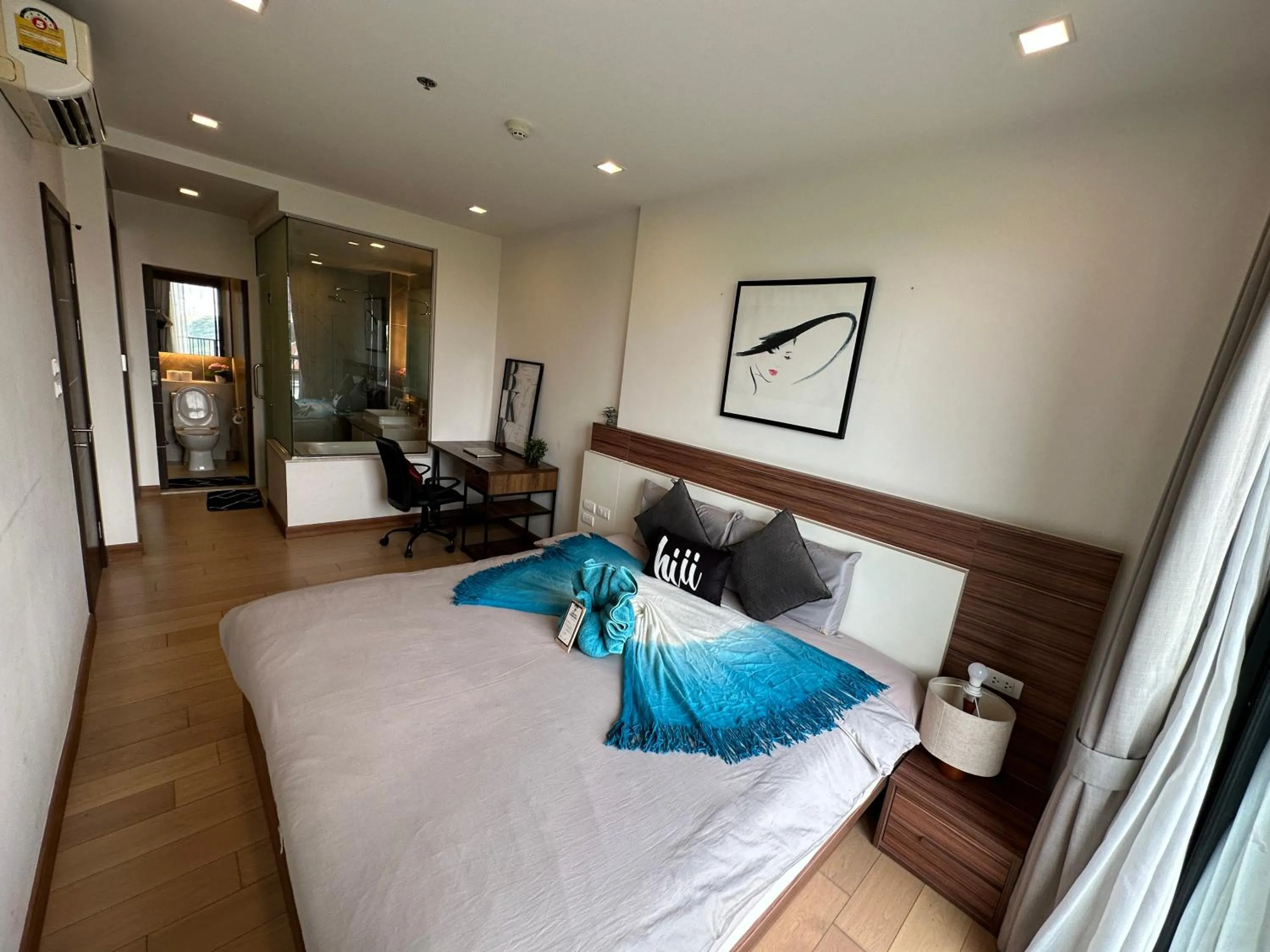 Bed in The Astra Condo Changkhlan in Chiang Mai