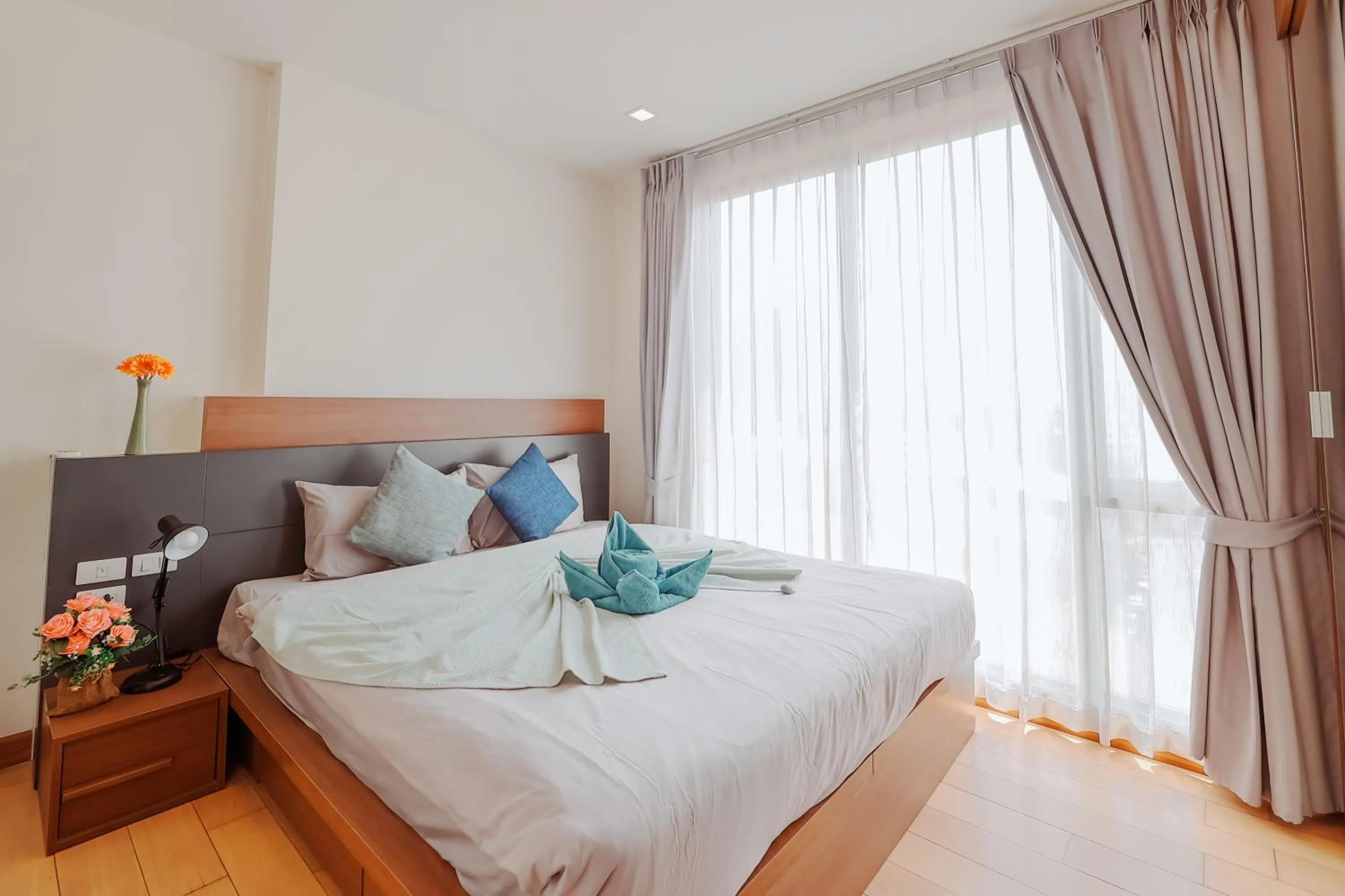 Bed in The Astra Condo Changkhlan in Chiang Mai