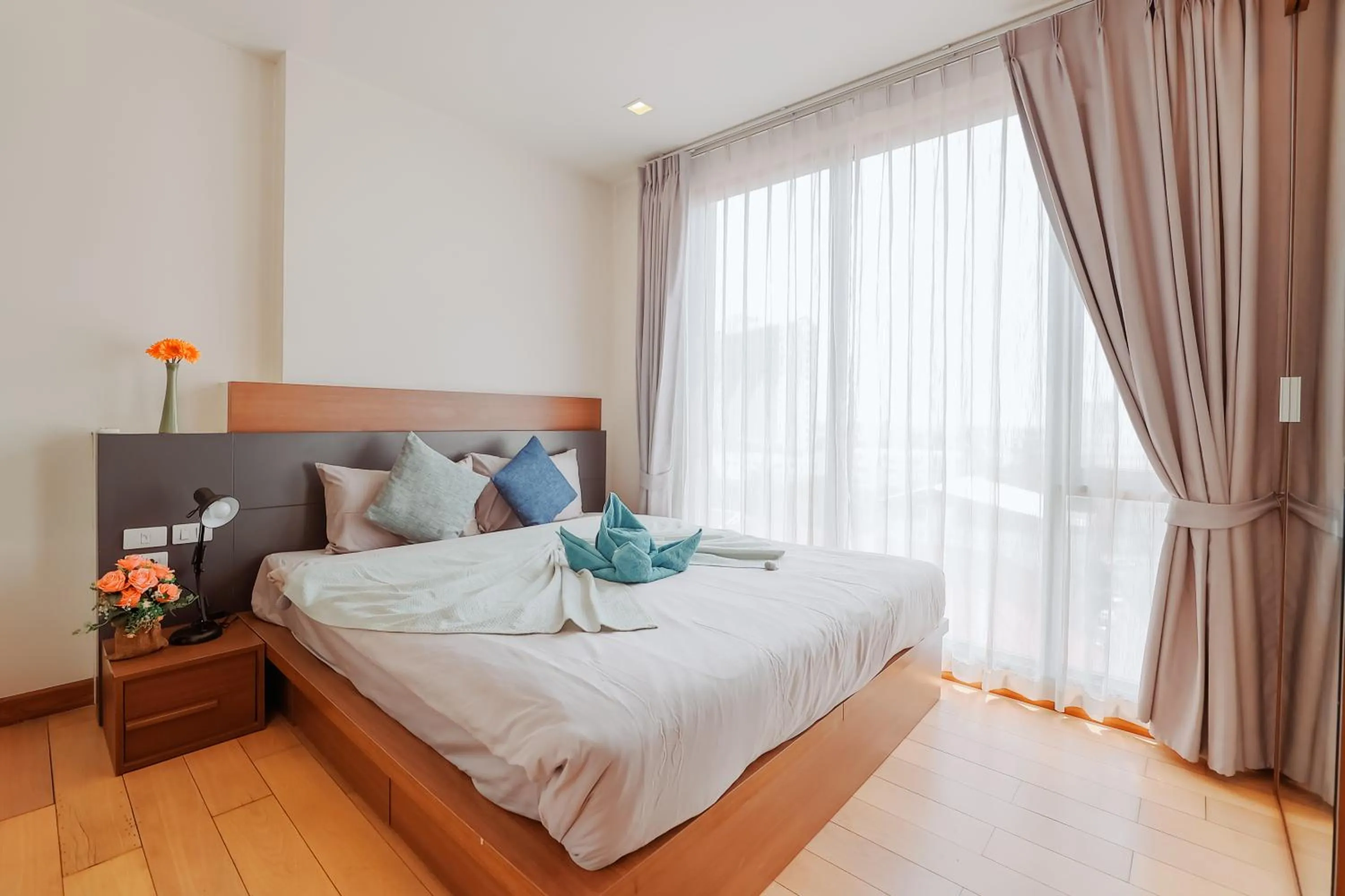 Bed in The Astra Condo Changkhlan in Chiang Mai