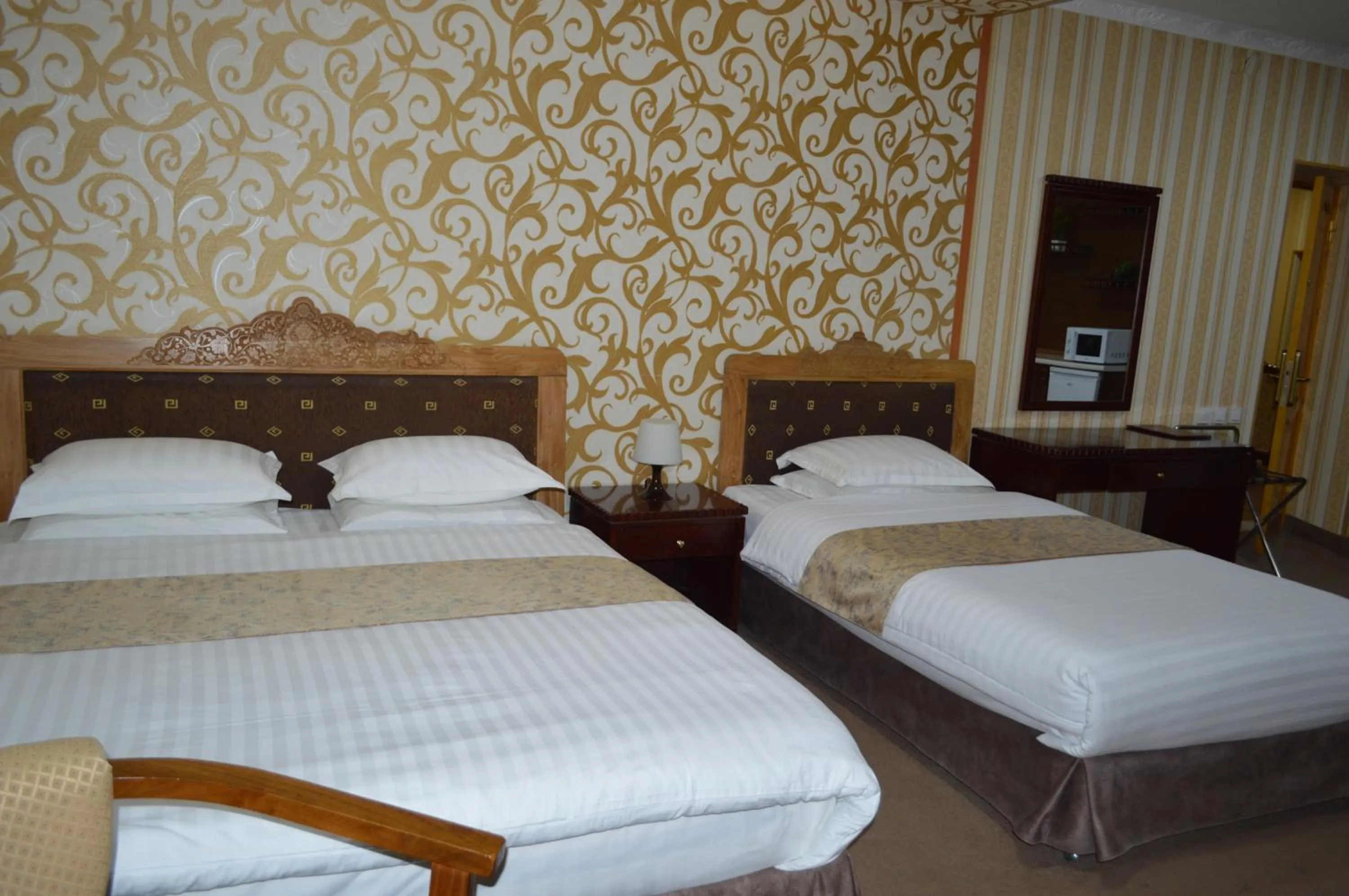 Bed in KABIR HOTEL