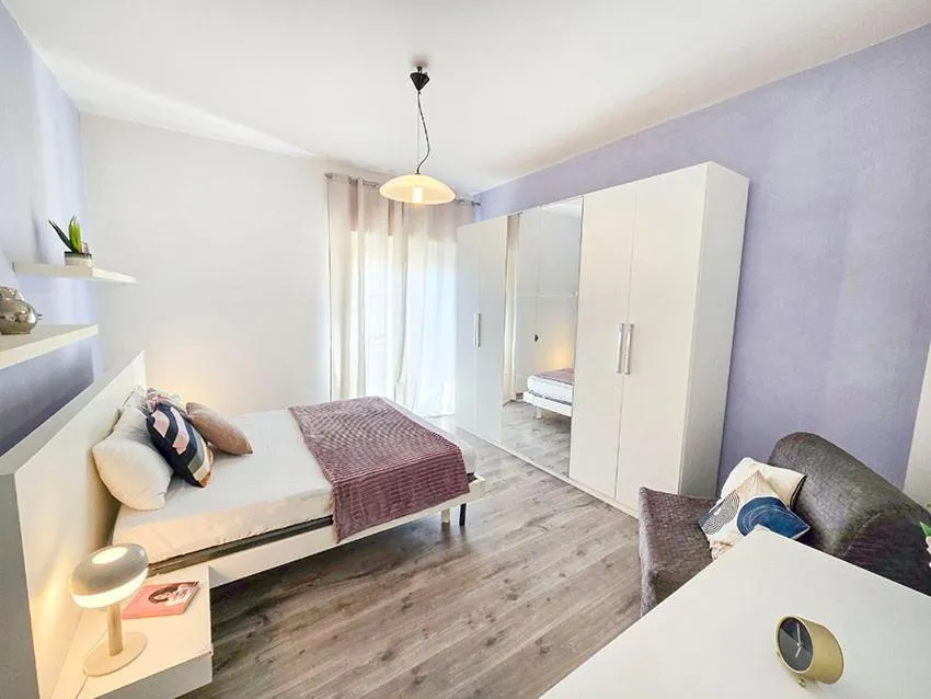 Bed in Ampio Quadrilocale 8 Pax vista mare