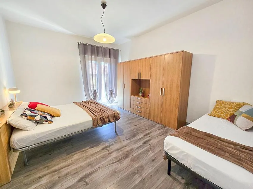 Bed in Ampio Quadrilocale 8 Pax vista mare