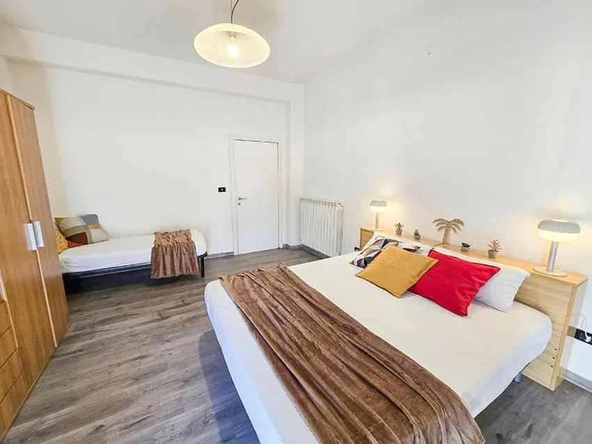 Bed in Ampio Quadrilocale 8 Pax vista mare