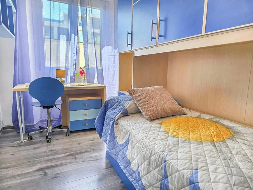 Bed in Ampio Quadrilocale 8 Pax vista mare