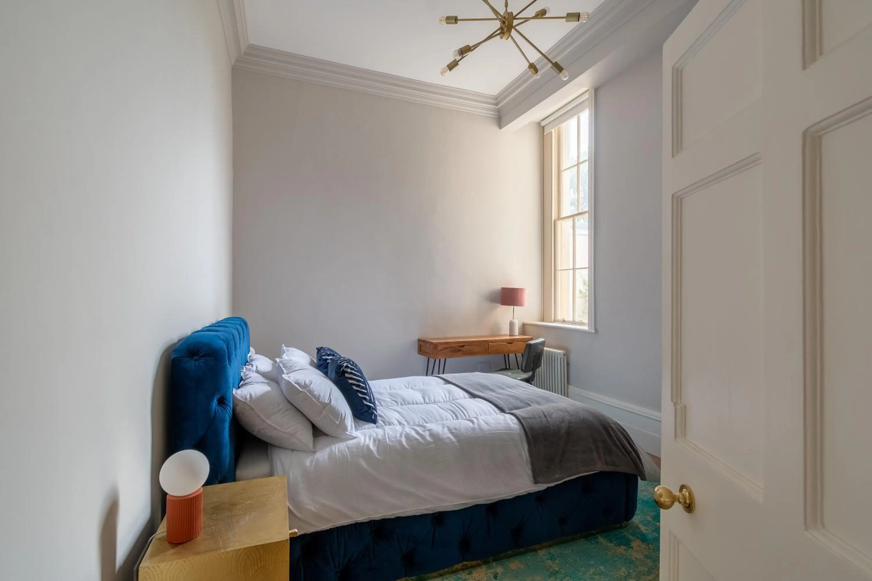 Bed in Russell House Suites
