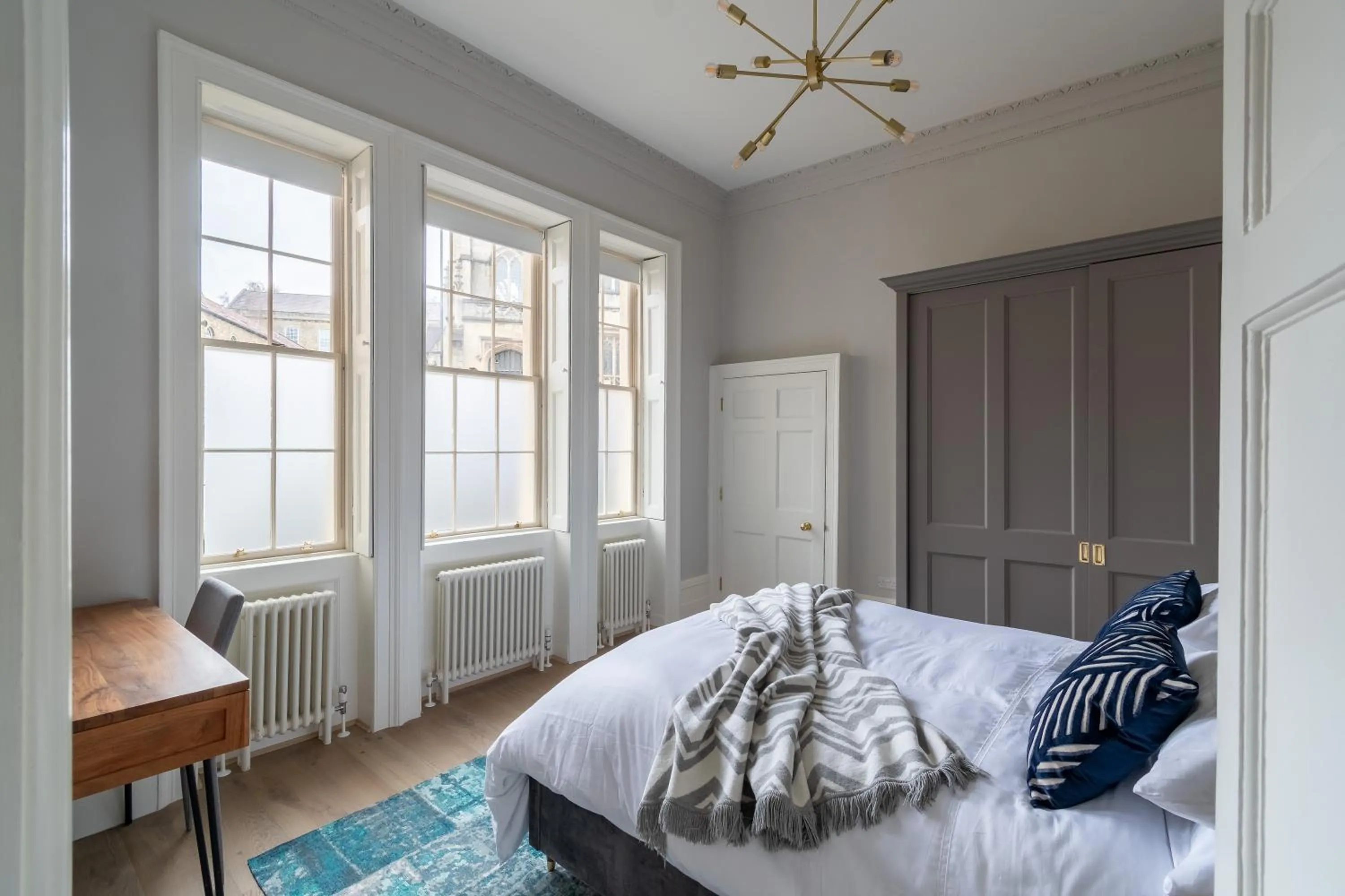 Bed in Russell House Suites