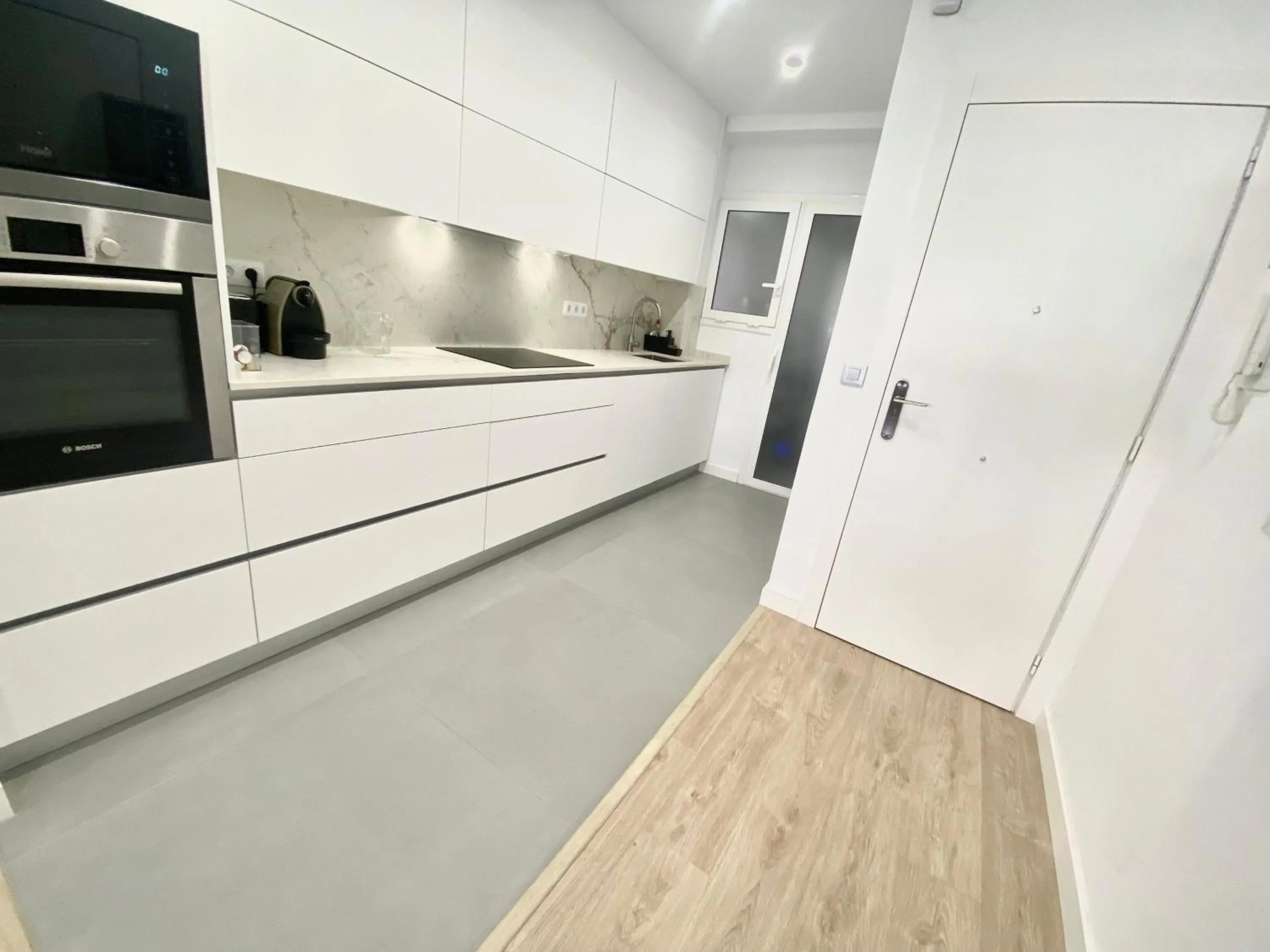 Kitchen or kitchenette in Barcelona Chic Apartments- Free Parking - 10 min BCN center by metro