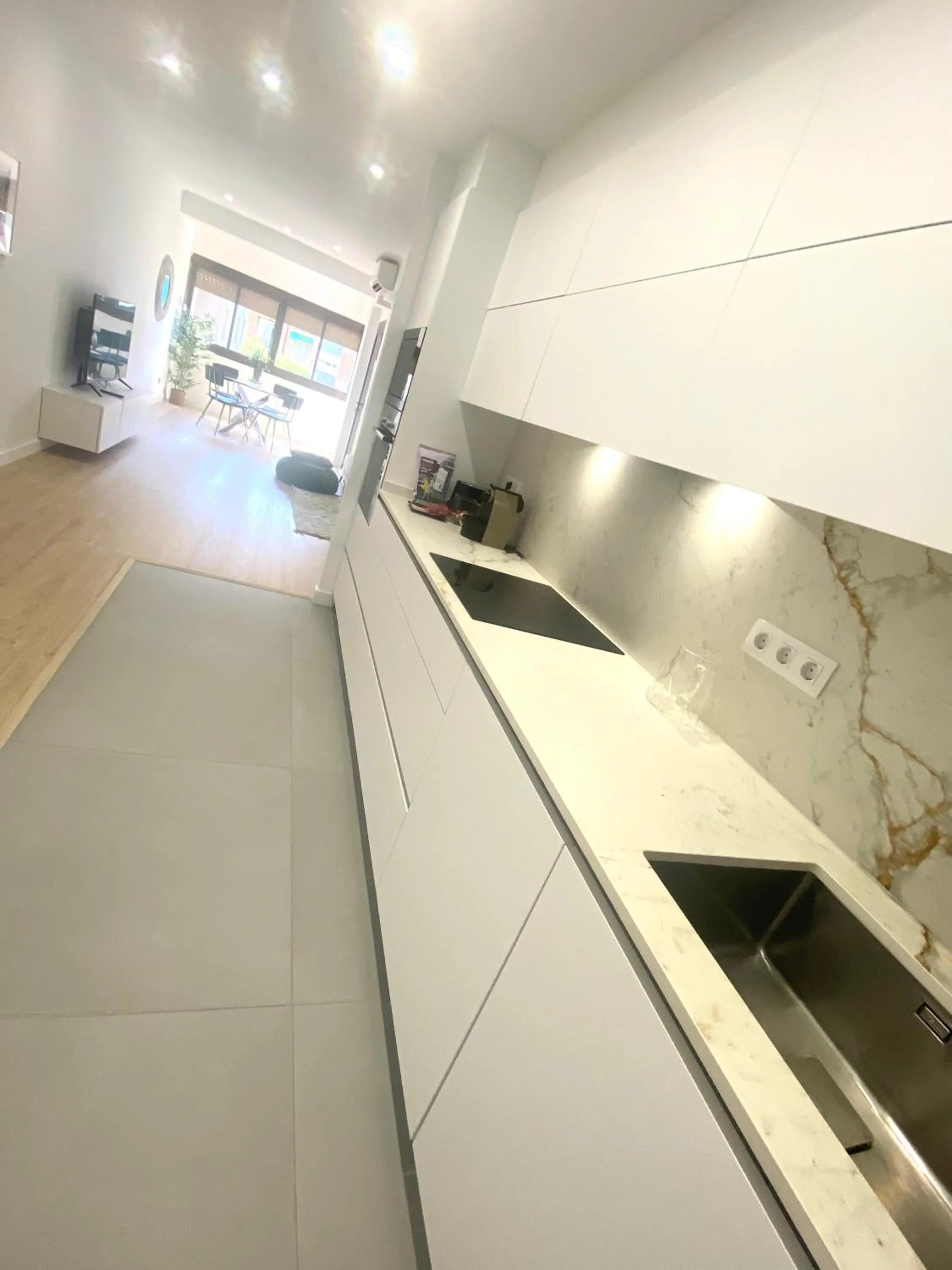 Kitchen or kitchenette in Barcelona Chic Apartments- Free Parking - 10 min BCN center by metro