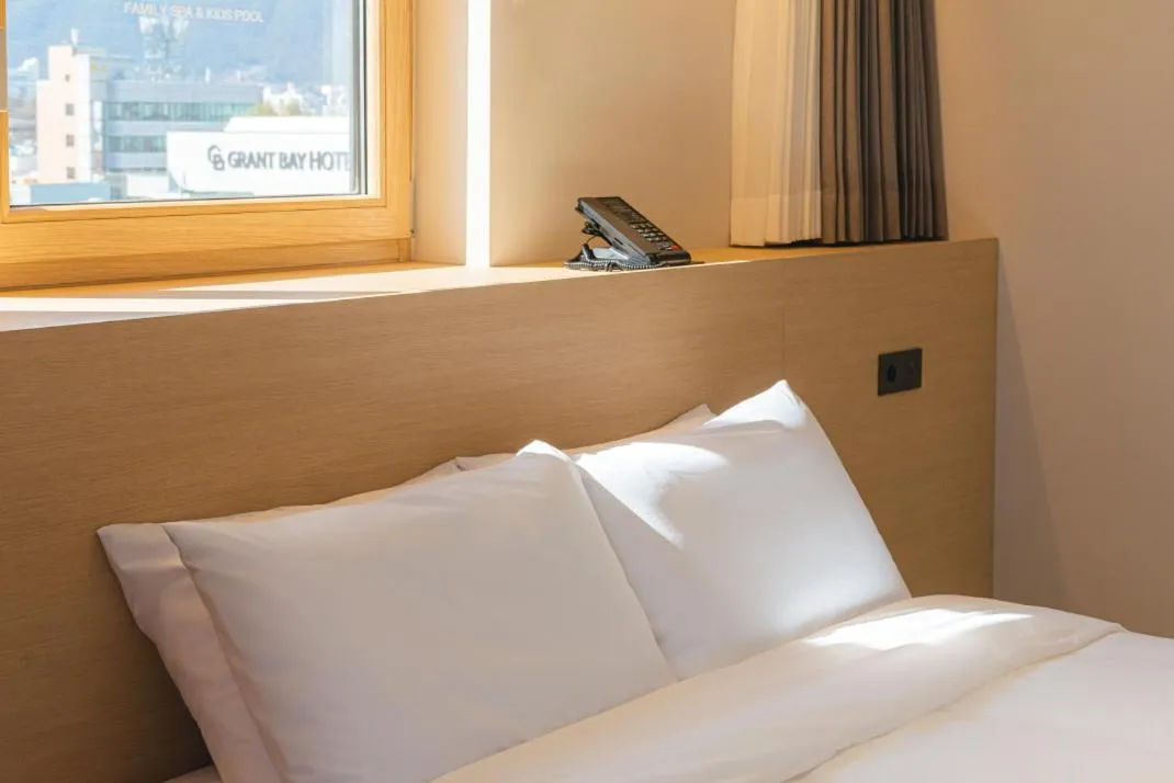 Bed in Asherah Villa d' aqua Hotel