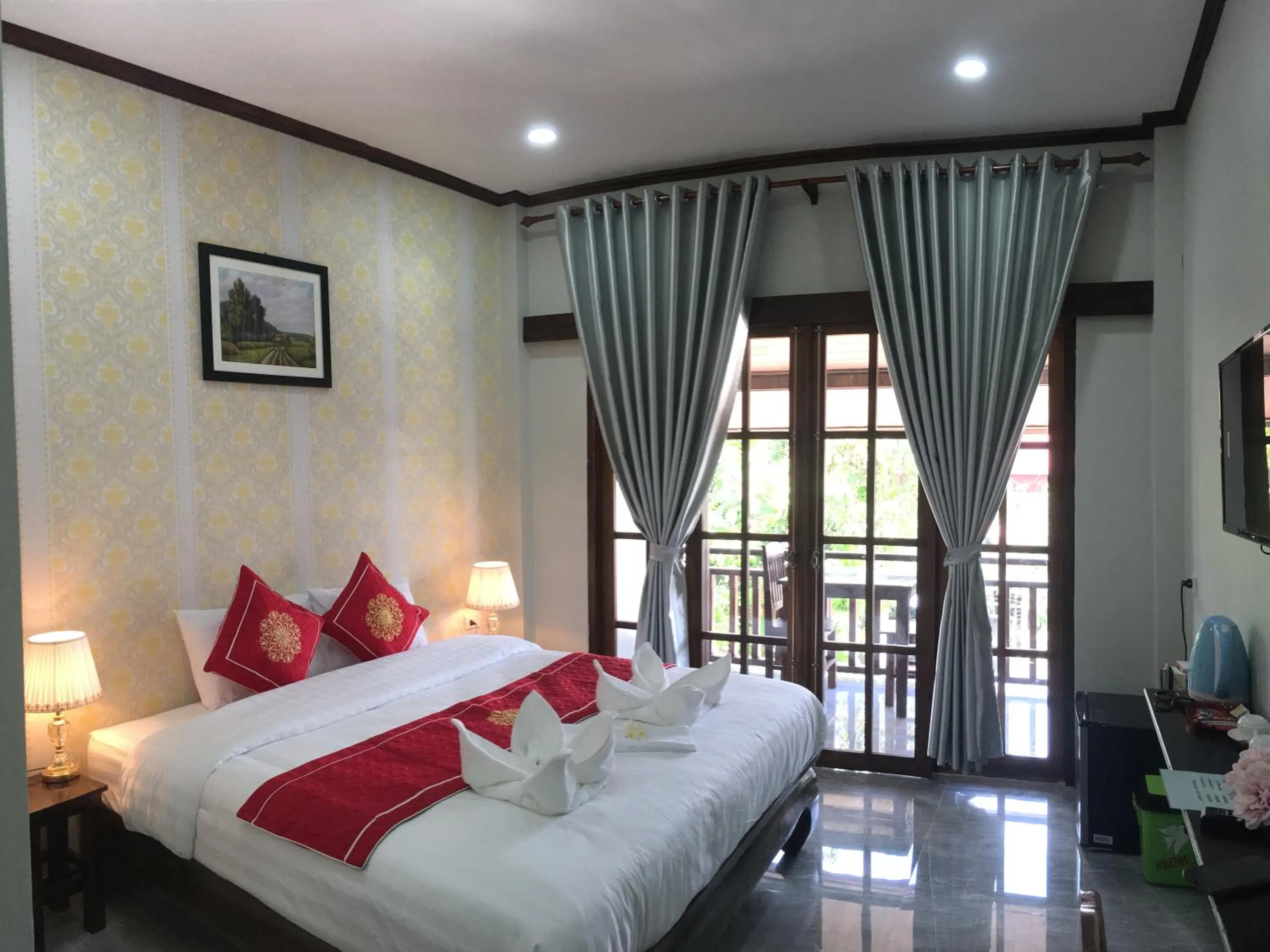 Bed in Le KhounSok Boutique Hotel