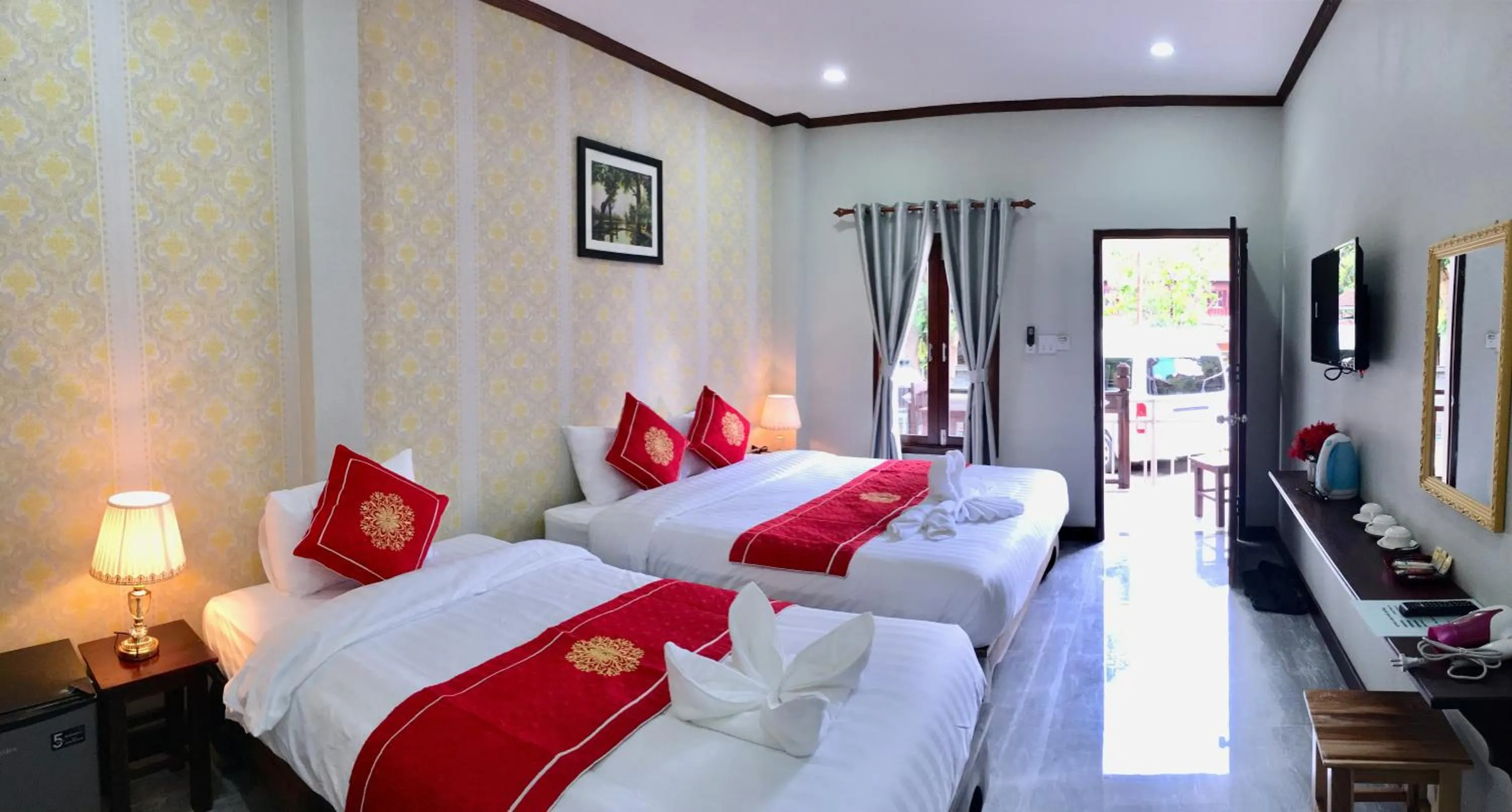 Bed in Le KhounSok Boutique Hotel