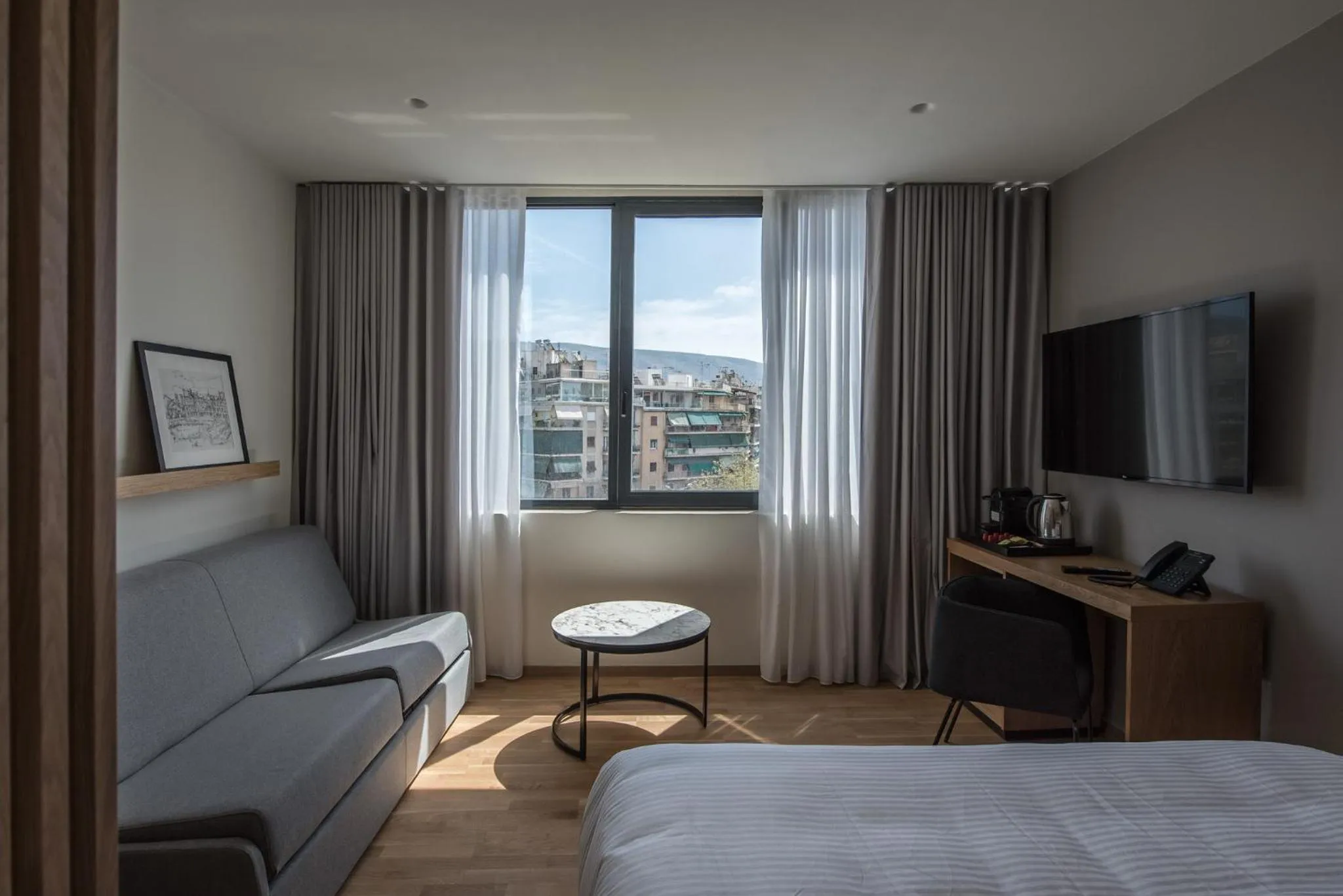 Communal lounge/ TV room, Bed in Urban Frame Acropolis