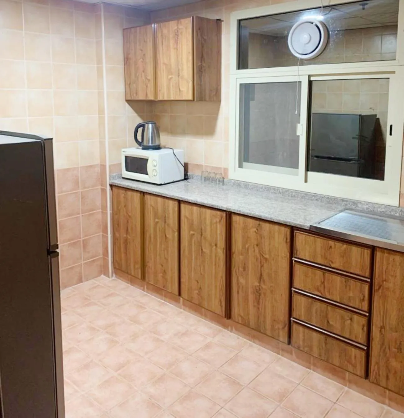 kitchen in AL MARJAN FURNISHED APARTMENTS