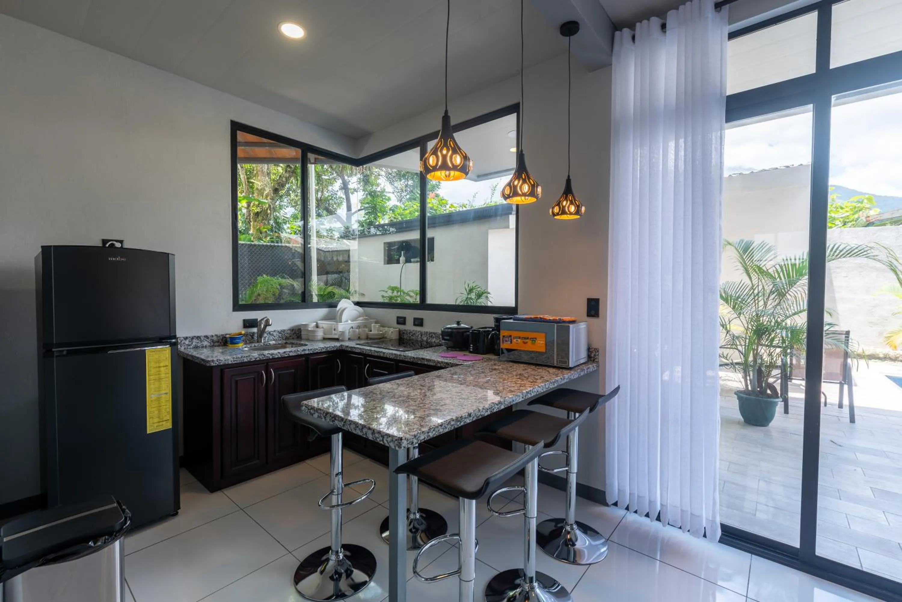 Kitchen or kitchenette in Villas Fortuna Boutique