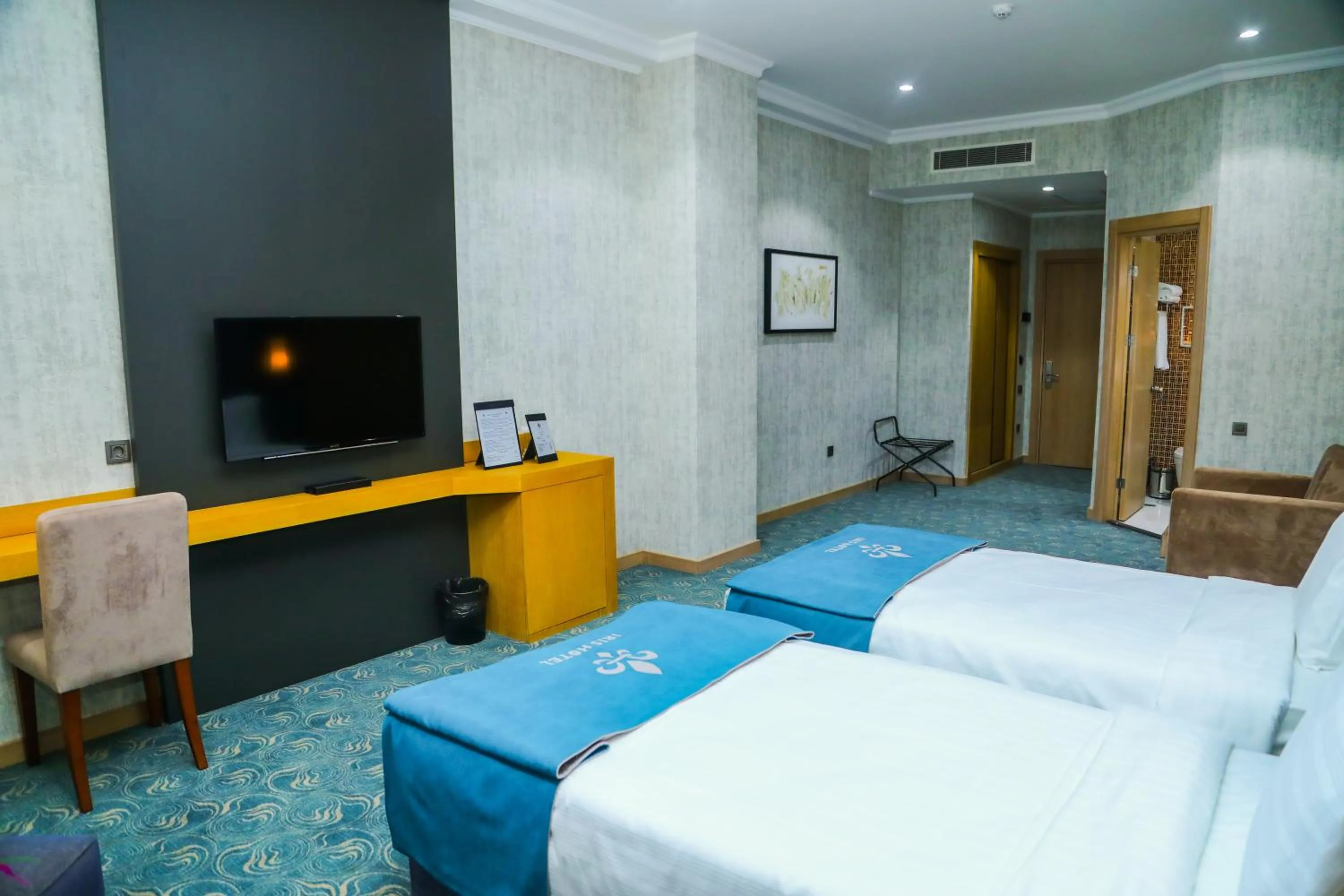 Communal lounge/ TV room, Bed in Iris Hotel Baku