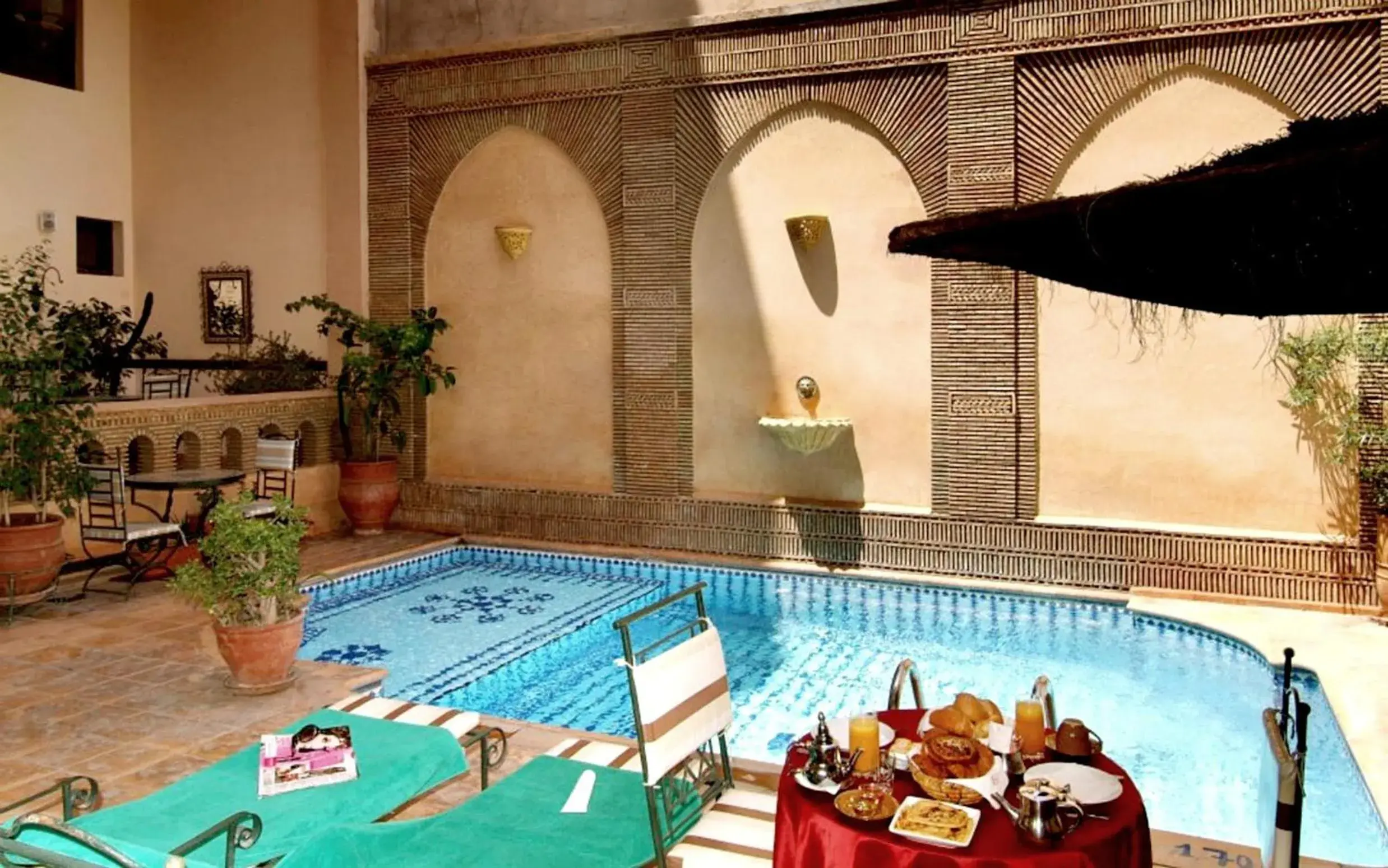 Swimming pool in Amani Hotel Suites & Spa Swimming pool in Amani Hotel Suites & Spa