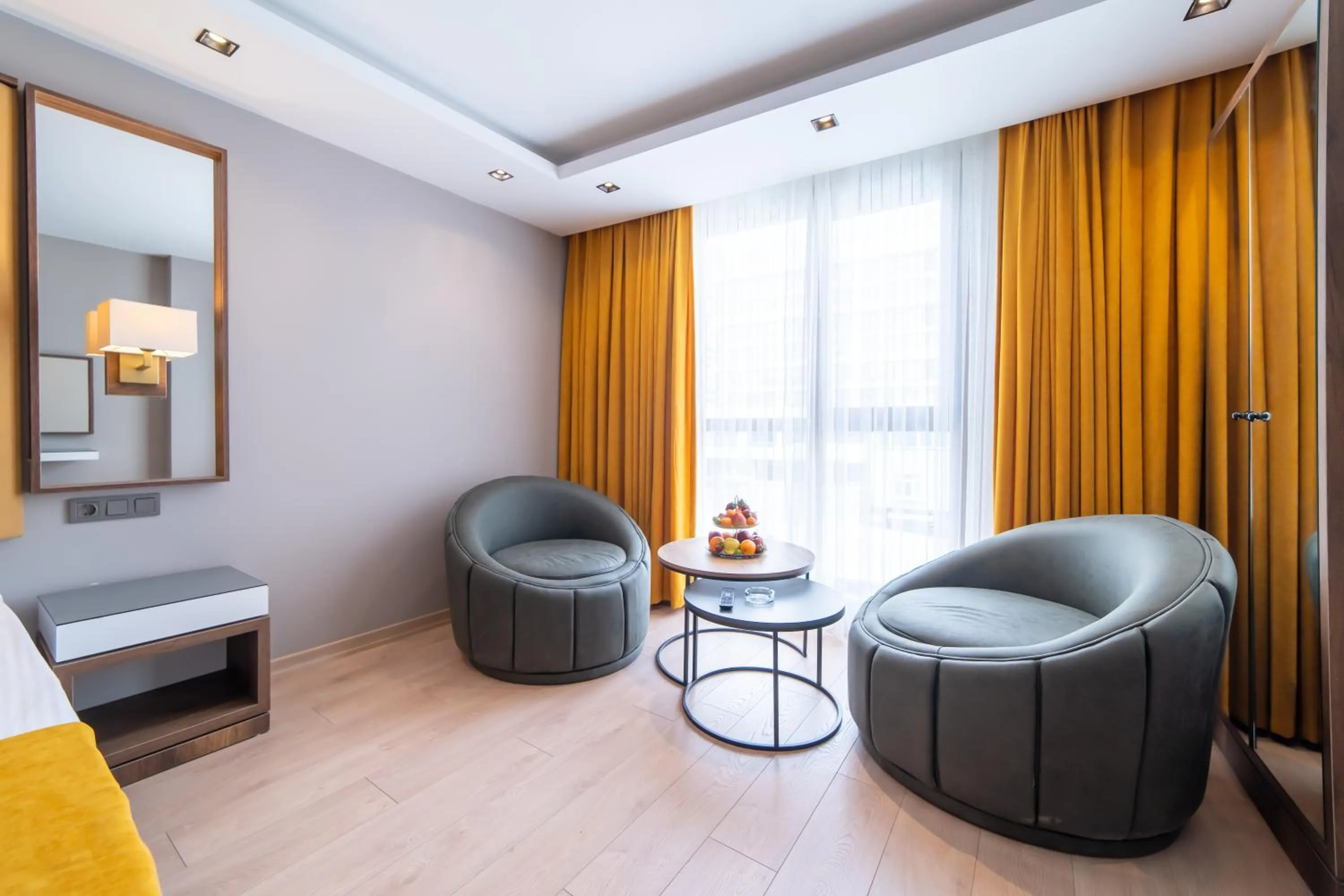 Living room, Bed in Garden Room Suit Hotel