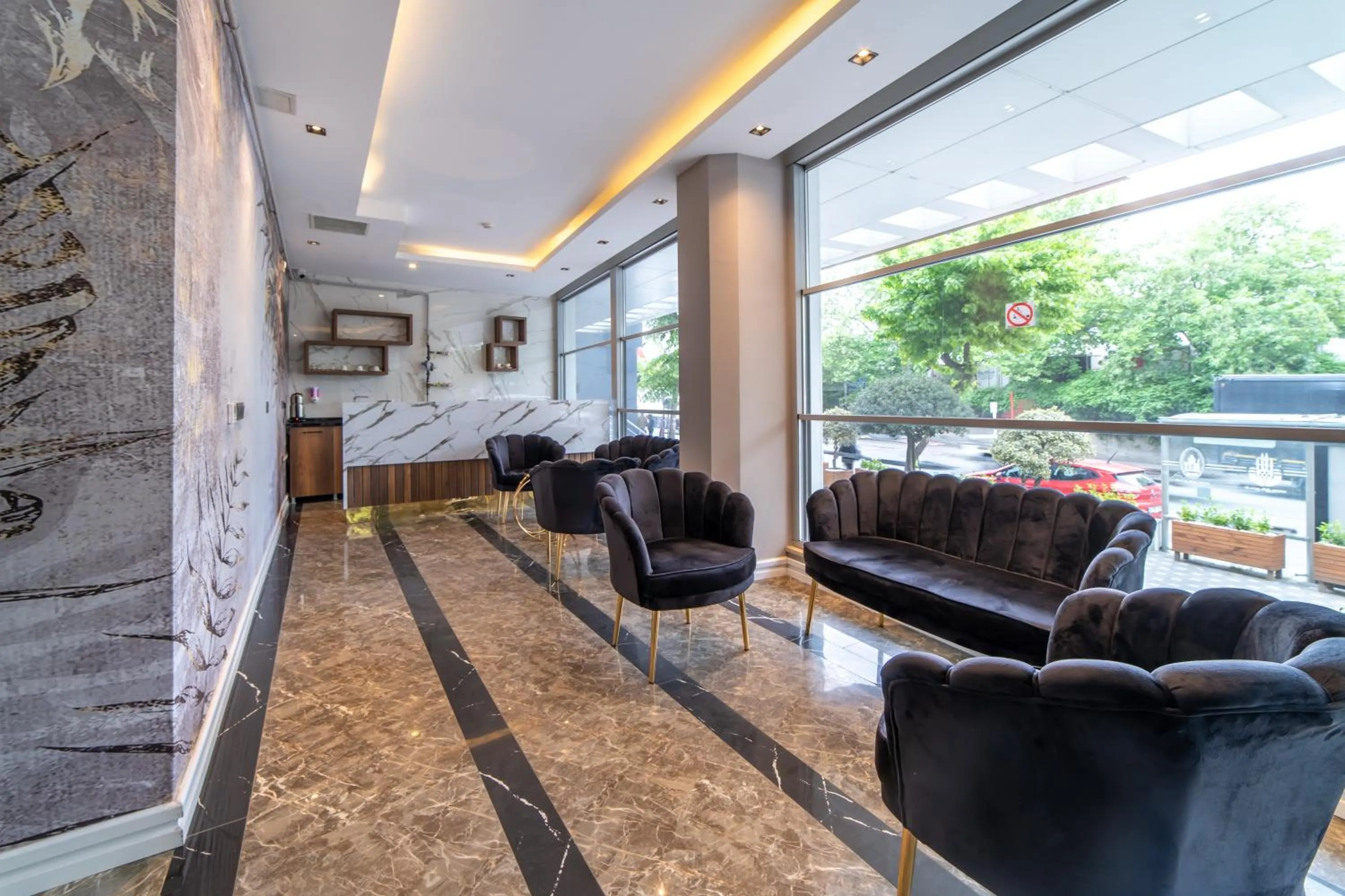 Lobby or reception in Garden Room Suit Hotel