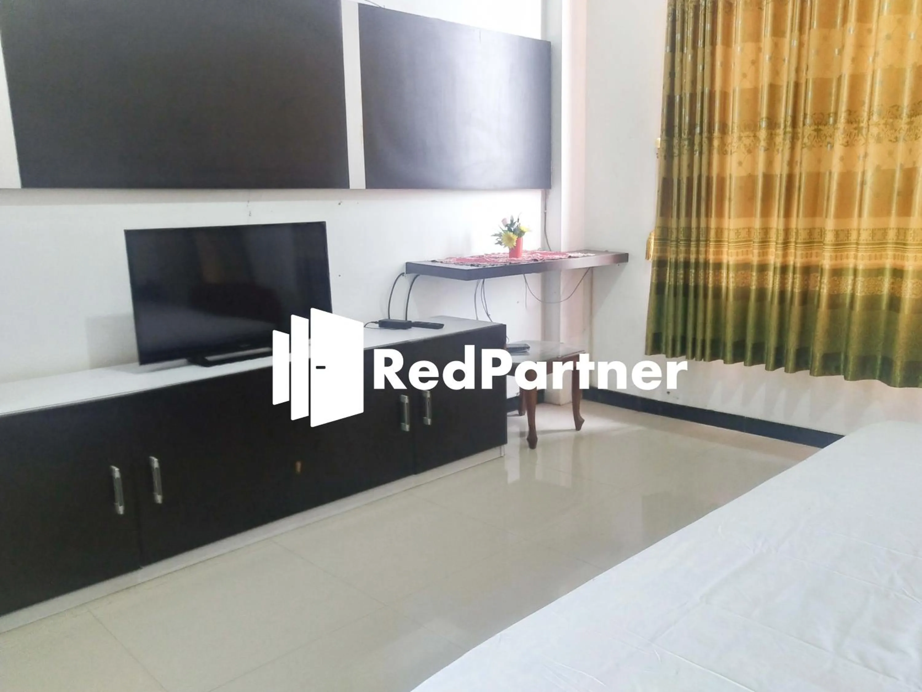 TV and multimedia in Riyani Residence At Jalan Ahmad Yani Pemalang Mitra RedDoorz