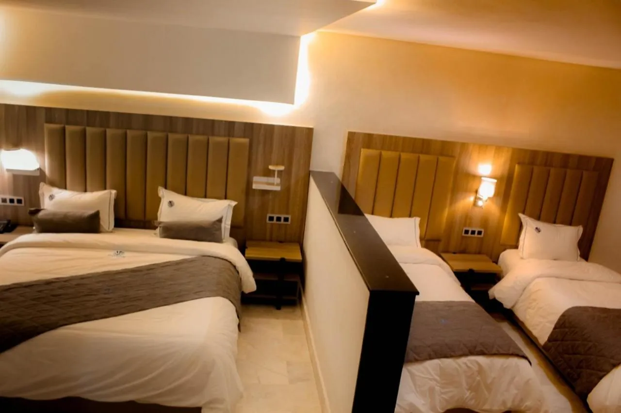 Bed in Hôtel La Perla