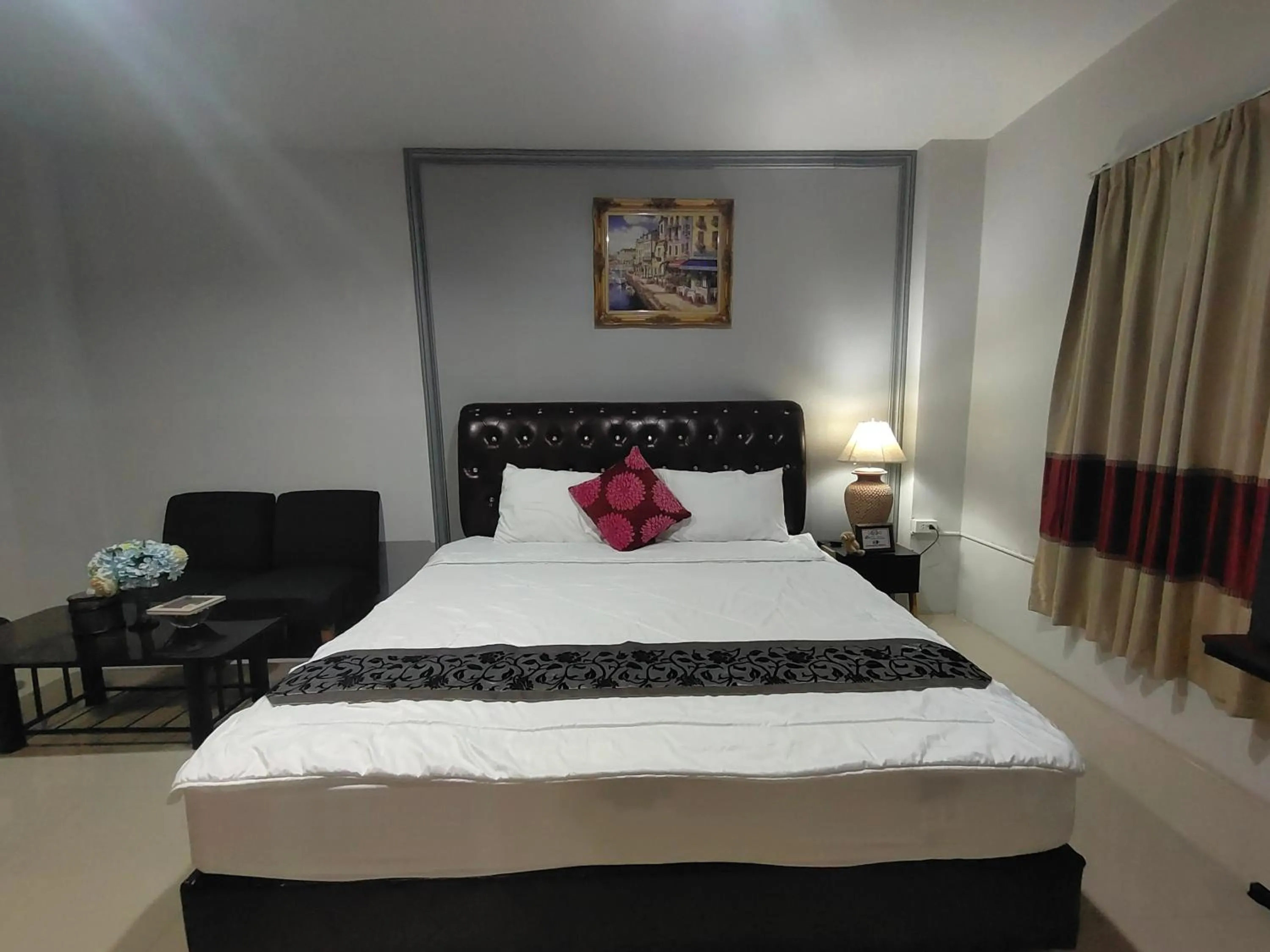 Bed in ห้องพักนครราชสีมา The Rich Room