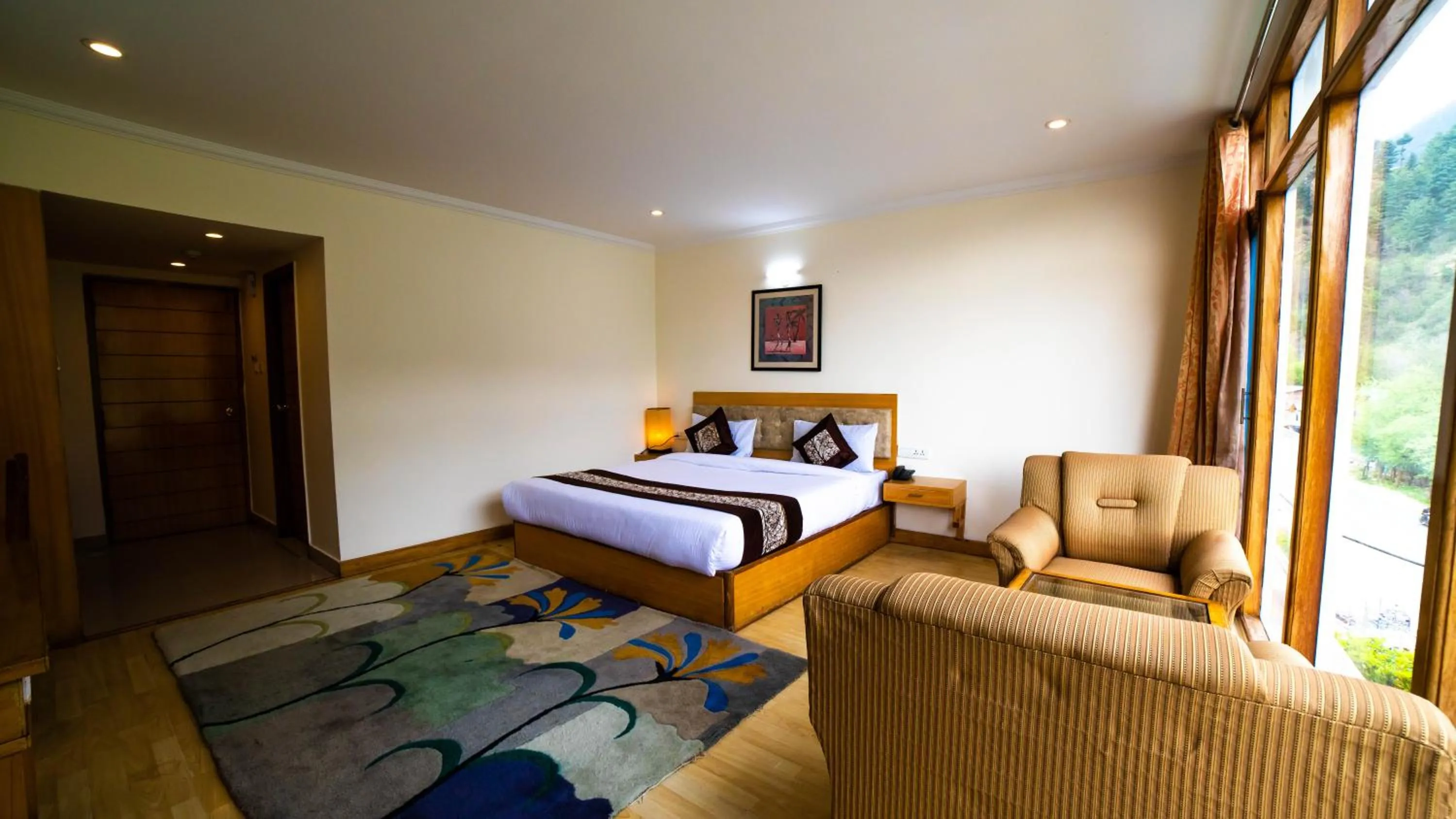 Seating area, Bed in Vaayu Resorts And Spa